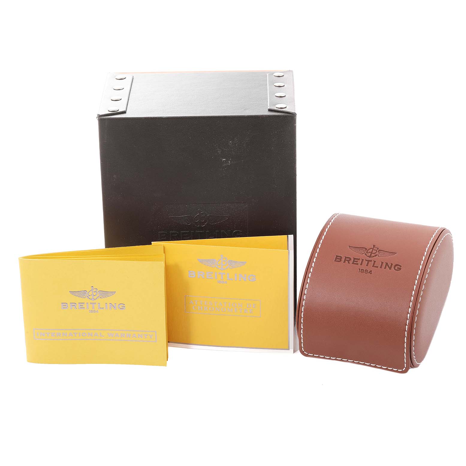 The image shows the packaging and accessories for a Breitling Colt A73380 Men's Stainless Steel Silver Dial A73380 Men's Stainless Steel Silver Dial watch, including the box, manuals, and a leather case.