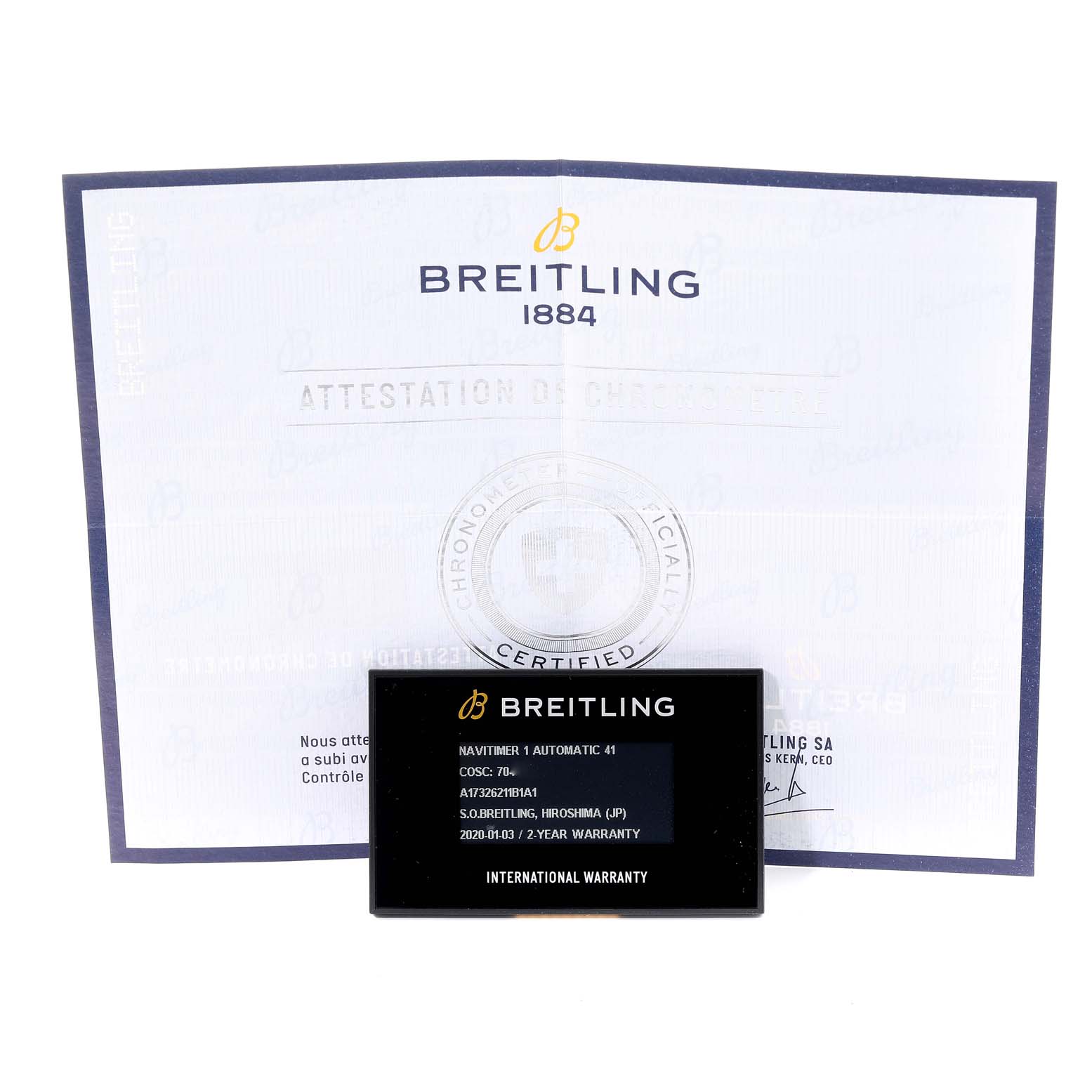 The image shows a certificate and warranty card for the Navitimer model by Breitling.