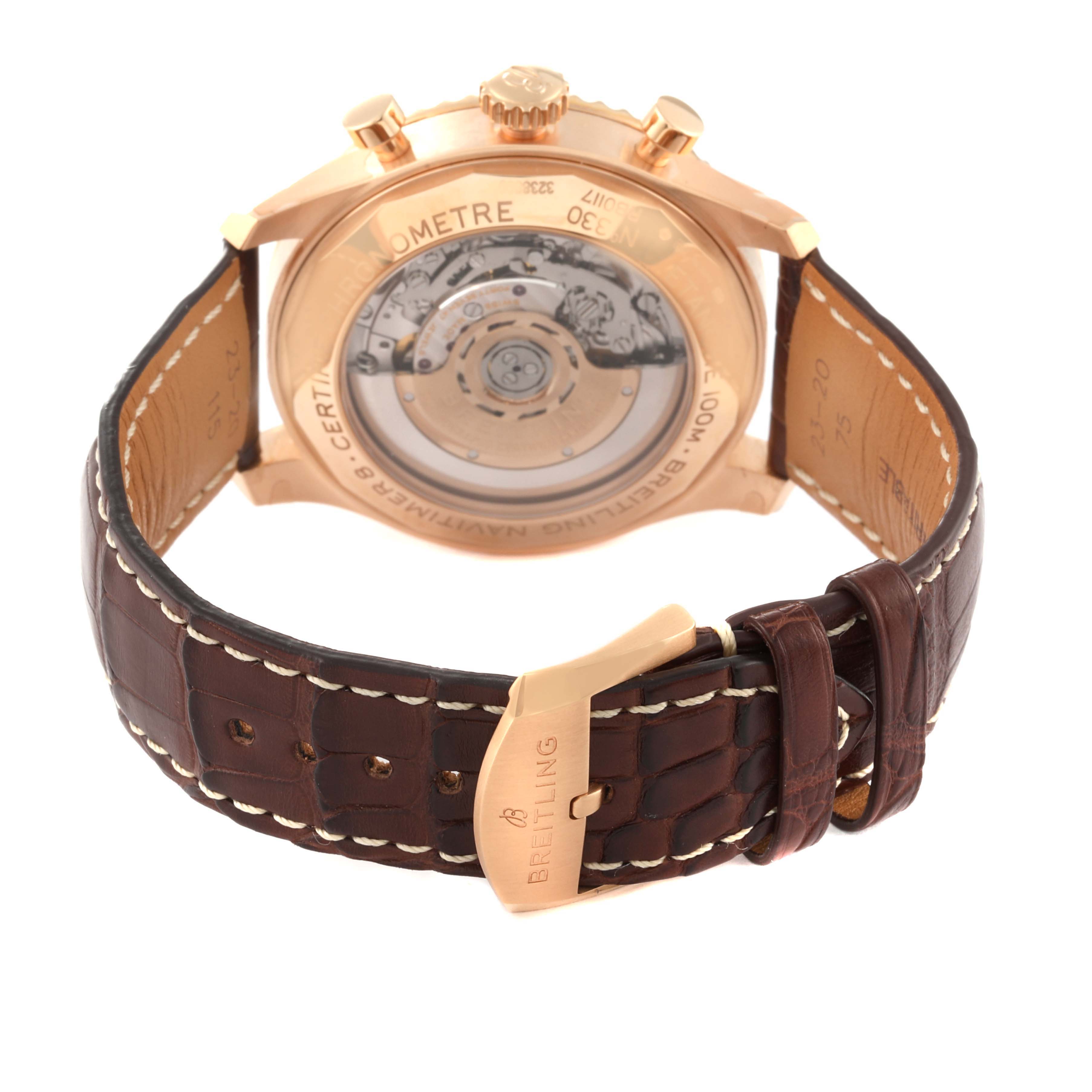 The image shows the back view of a Breitling Navitimer watch, highlighting the exhibition case back and the leather strap with a clasp.