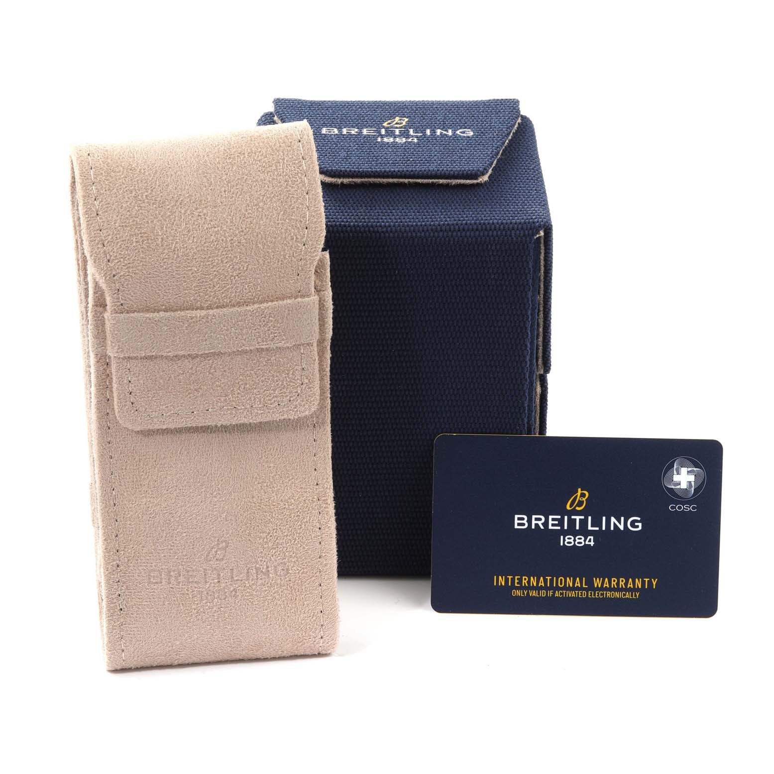 The image shows a Breitling Navitimer watch accessory set including a beige case, a blue box, and an international warranty card.