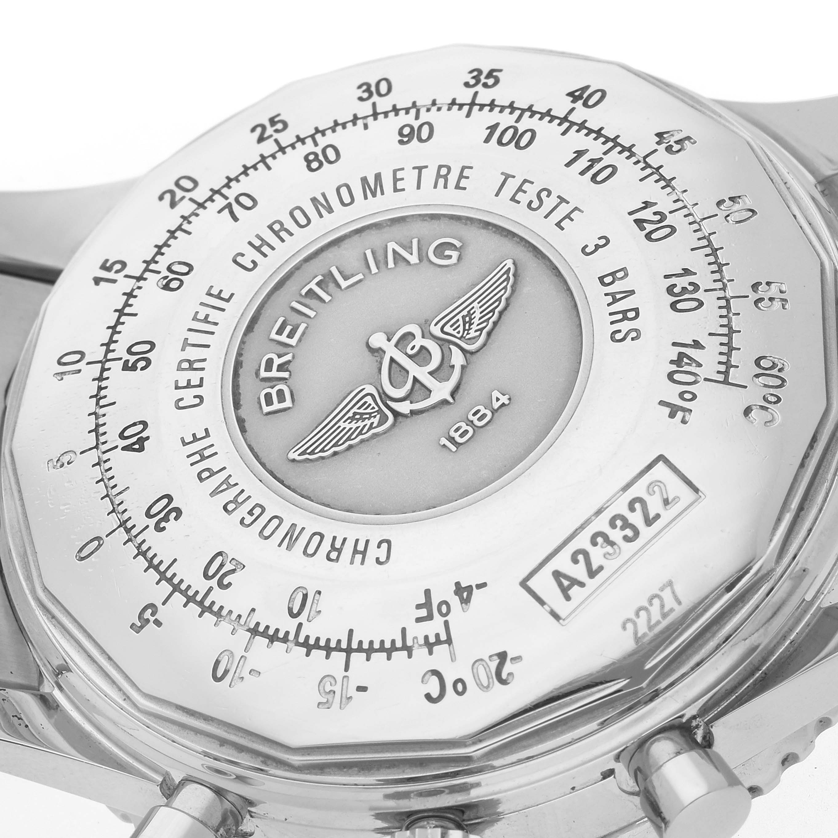 The image shows the back case of a Breitling Navitimer A23322 Men
s Stainless Steel Black Dial A23322 Men
s Stainless Steel Black Dial watch, showcasing its engravings and certification details.