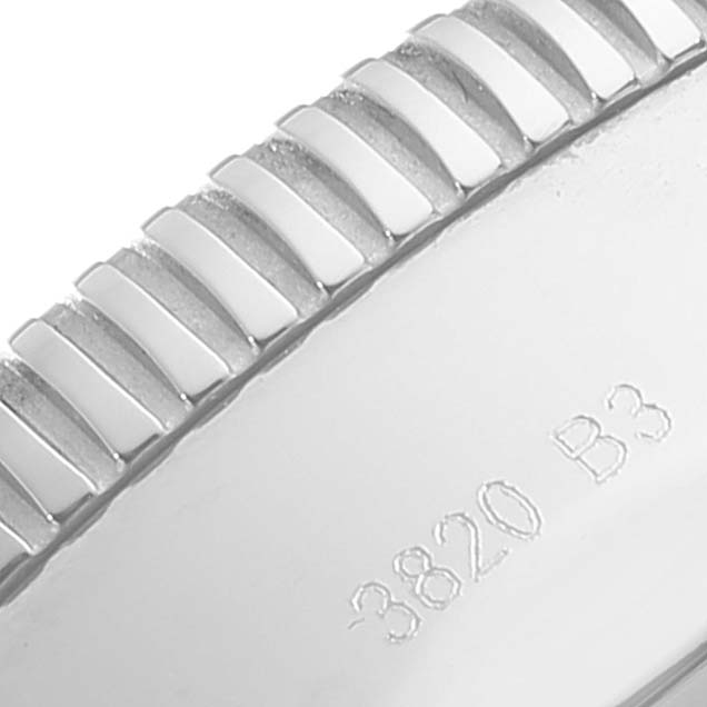 The image shows a close-up of the bezel and edge of a Breitling Superocean A13313 Men's Stainless Steel Blue Dial A13313 Men's Stainless Steel Blue Dial watch with some engraved numbers.