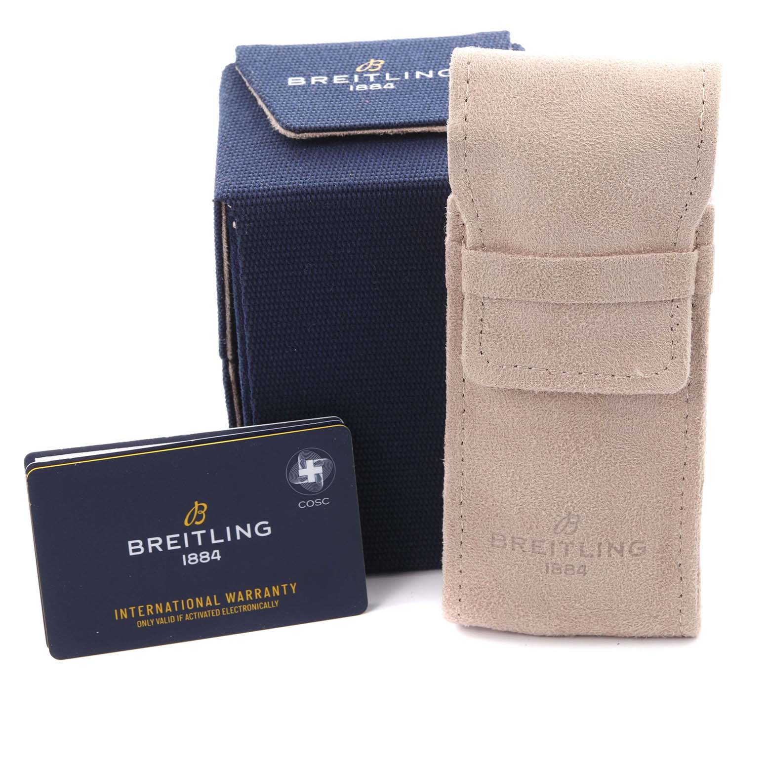 The image shows a suede pouch, a warranty card, and a box, all accessories for the Breitling Superocean A13313 Men's Stainless Steel Green Dial A13313 Men's Stainless Steel Green Dial model.