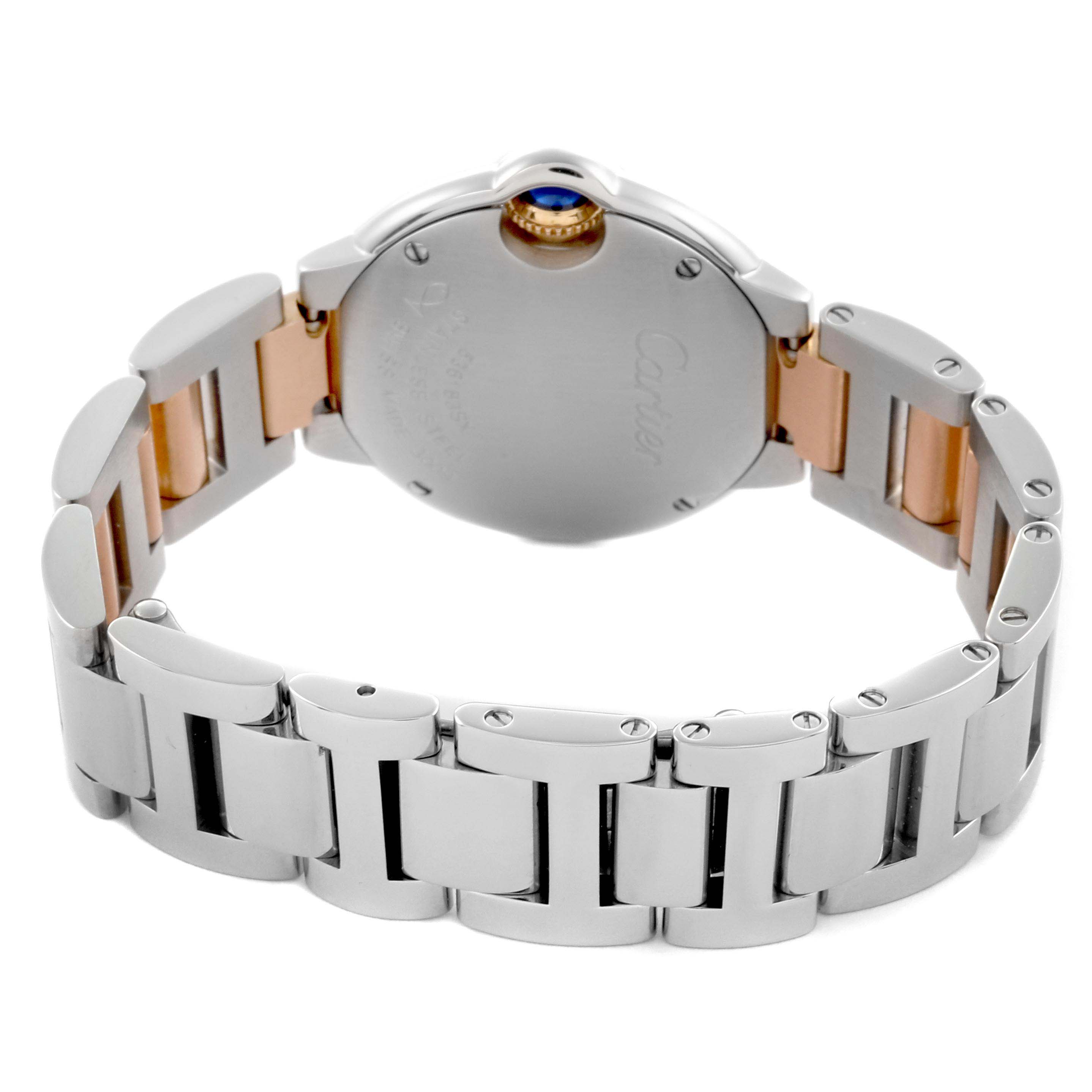 The image shows the back view of a Cartier Ballon Bleu WE902030 Women
s Steel and Gold (two tone) Silver Dial WE902030 Women
s Steel and Gold (two tone) Silver Dial watch, highlighting its metal bracelet and case back.