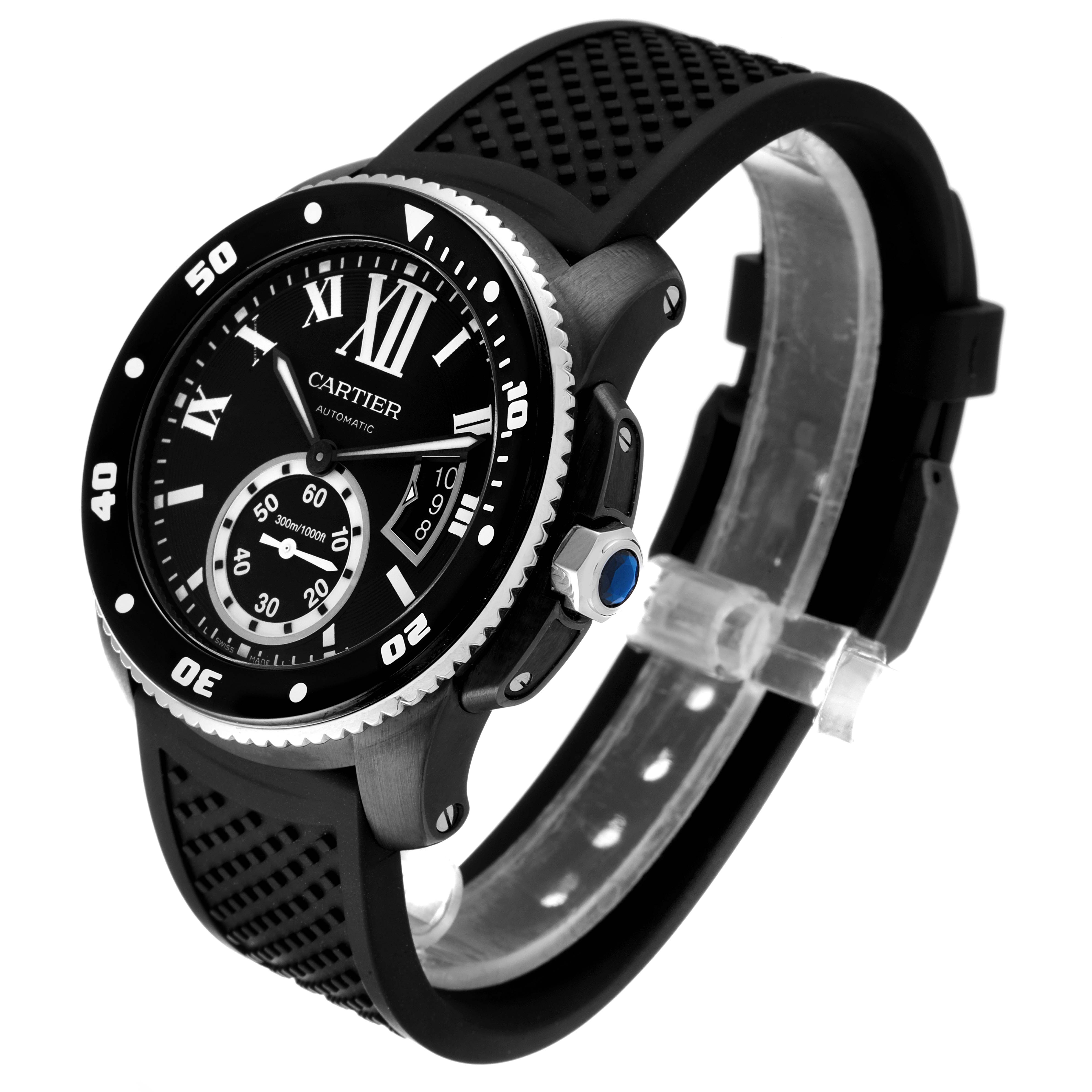 The Calibre de Cartier watch is shown at a slight angle, highlighting the face, bezel, and rubber strap.