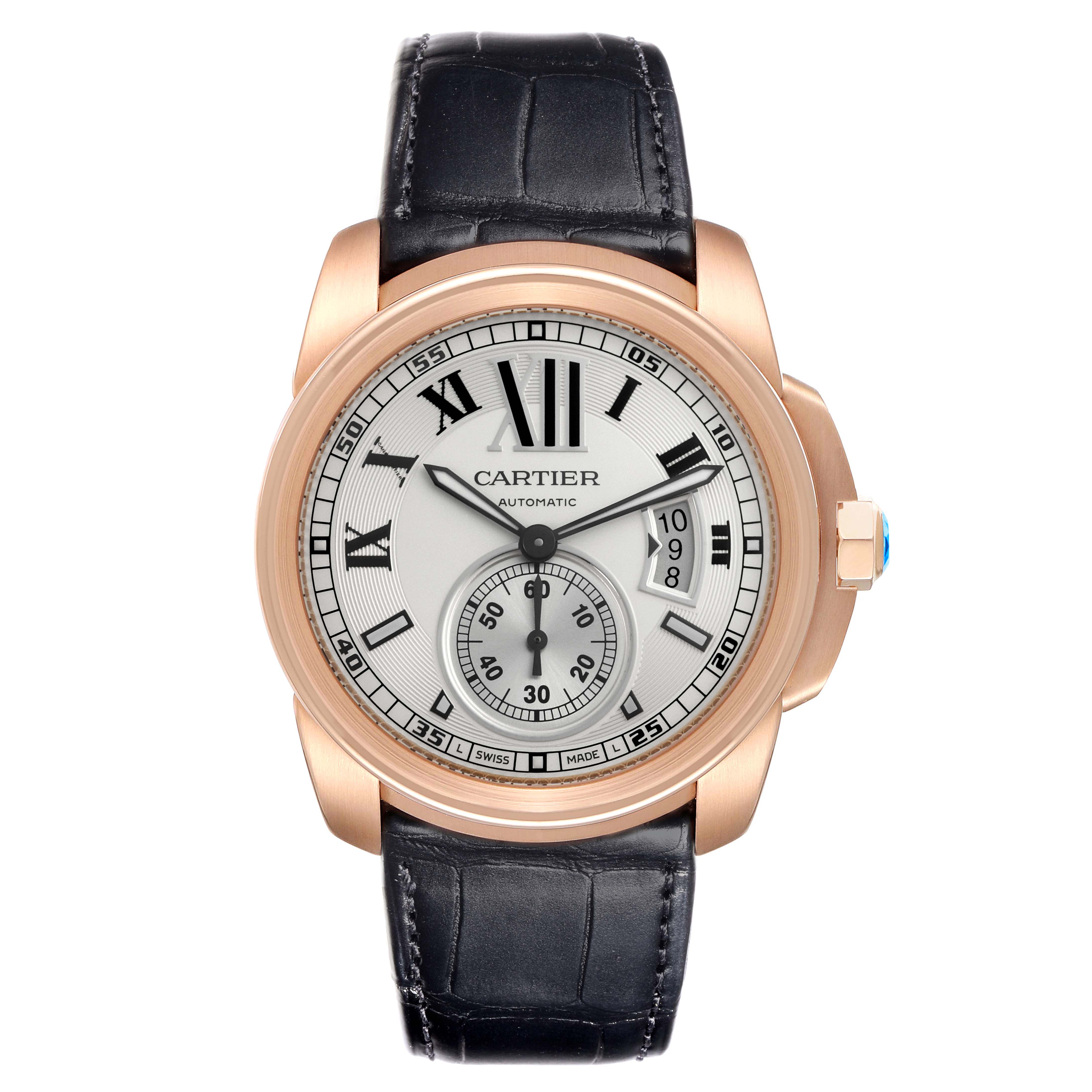The image shows a front view of the Calibre de Cartier watch by Cartier, highlighting the face, case, and part of the strap.