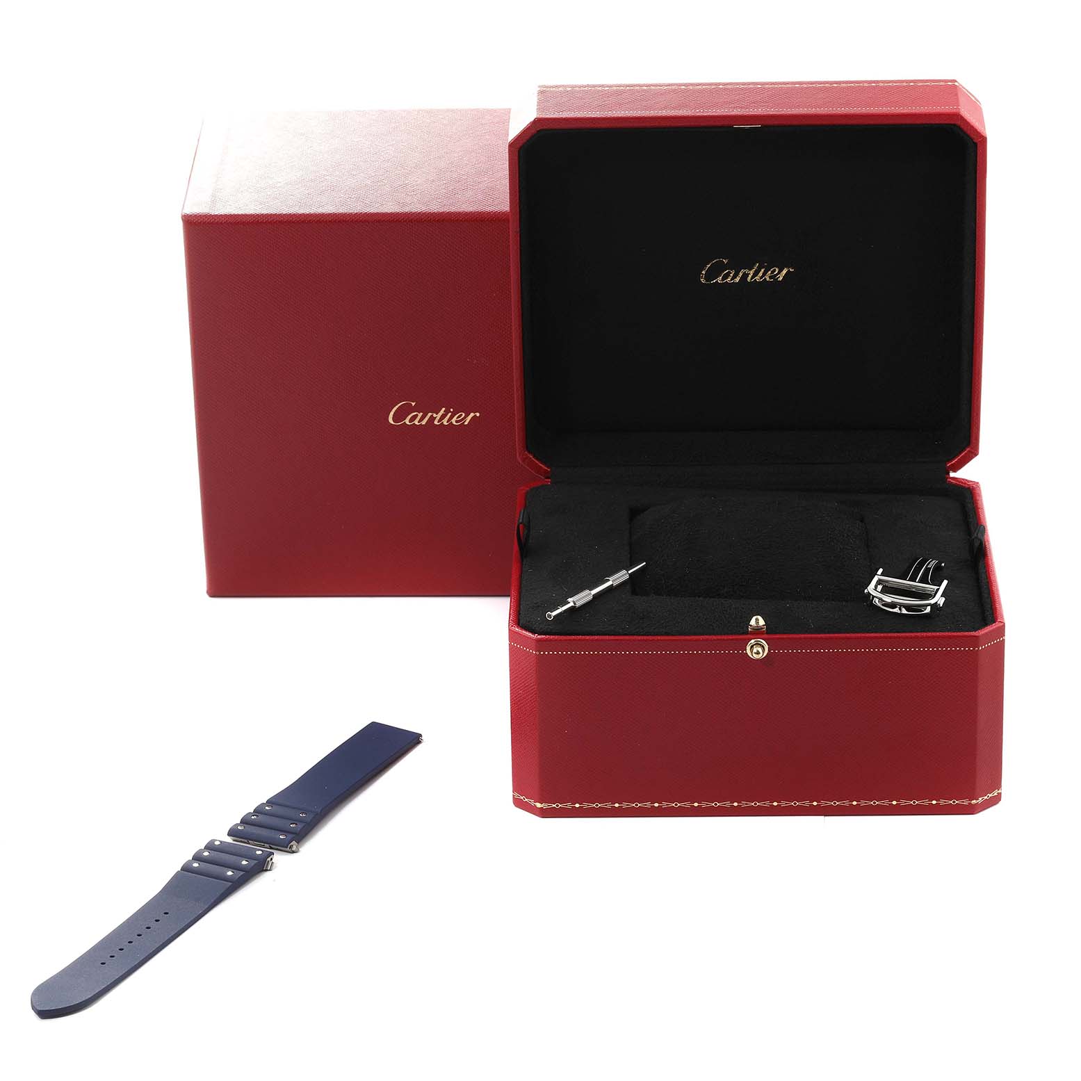 The image shows the Cartier Santos WSSA0048 Men
s Stainless Steel Blue Dial WSSA0048 Men
s Stainless Steel Blue Dial watch box and accessories, including a strap, buckle, and tool from a front angle.