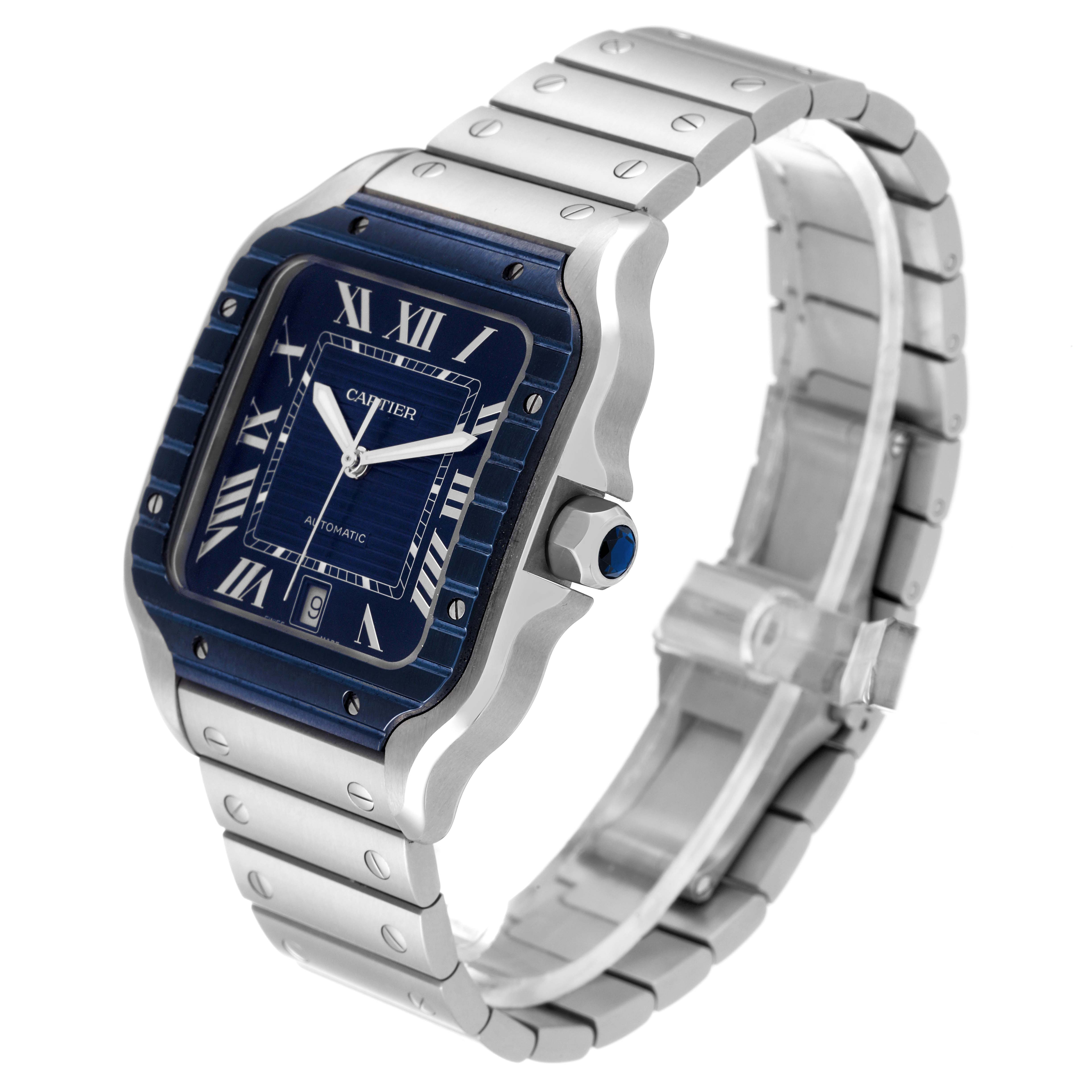 The Cartier Santos WSSA0048 Men
s Stainless Steel Blue Dial WSSA0048 Men
s Stainless Steel Blue Dial watch is displayed from a three-quarter angle, showing the blue dial, bezel, crown, and metal bracelet.