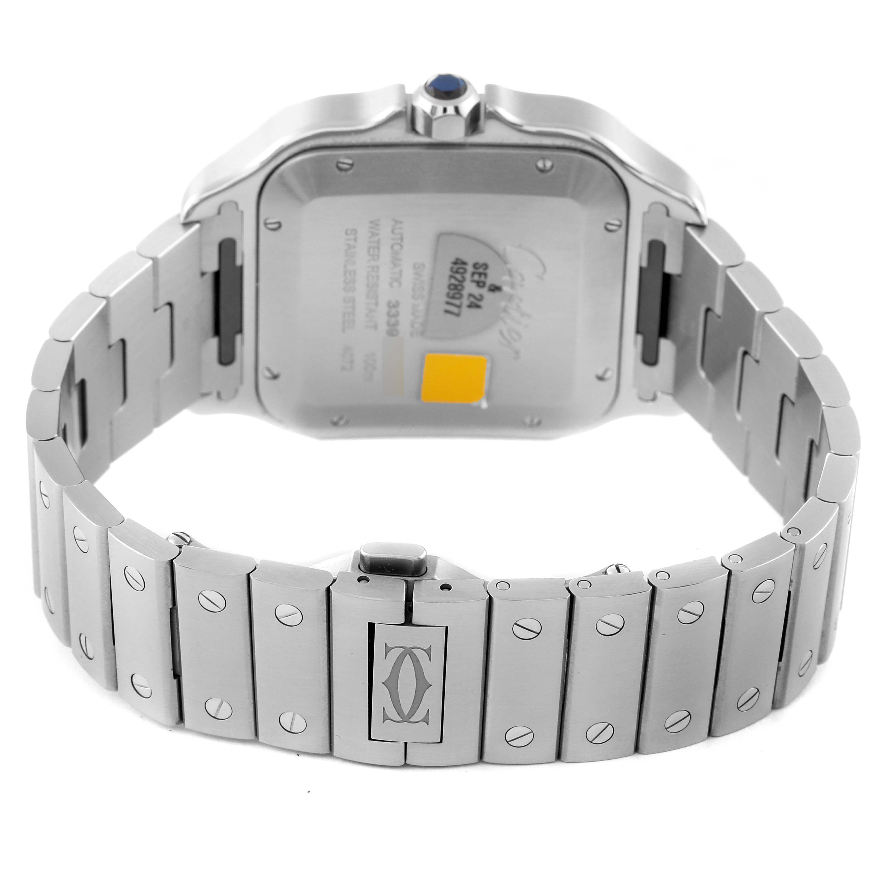 This image shows the back view of the Santos model by Cartier, focusing on the stainless steel bracelet and case back.