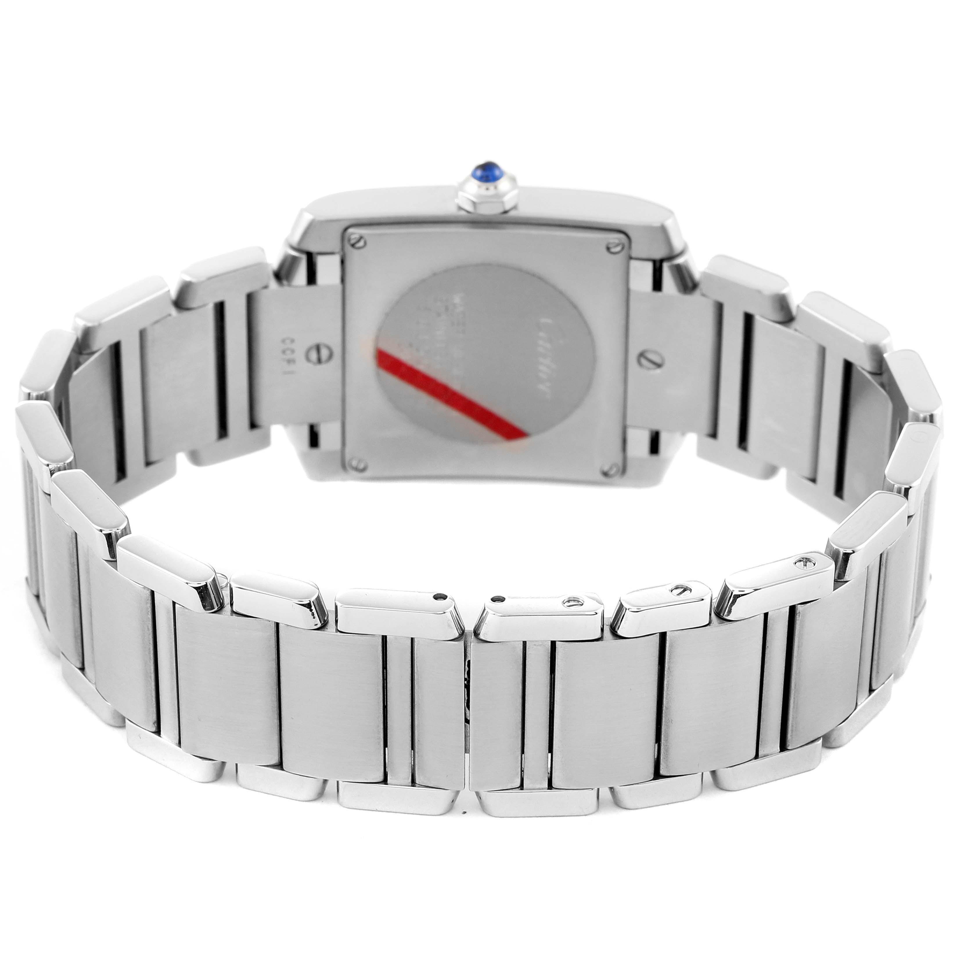 The Cartier Tank Française watch is shown from the back, displaying its stainless steel bracelet and case back.