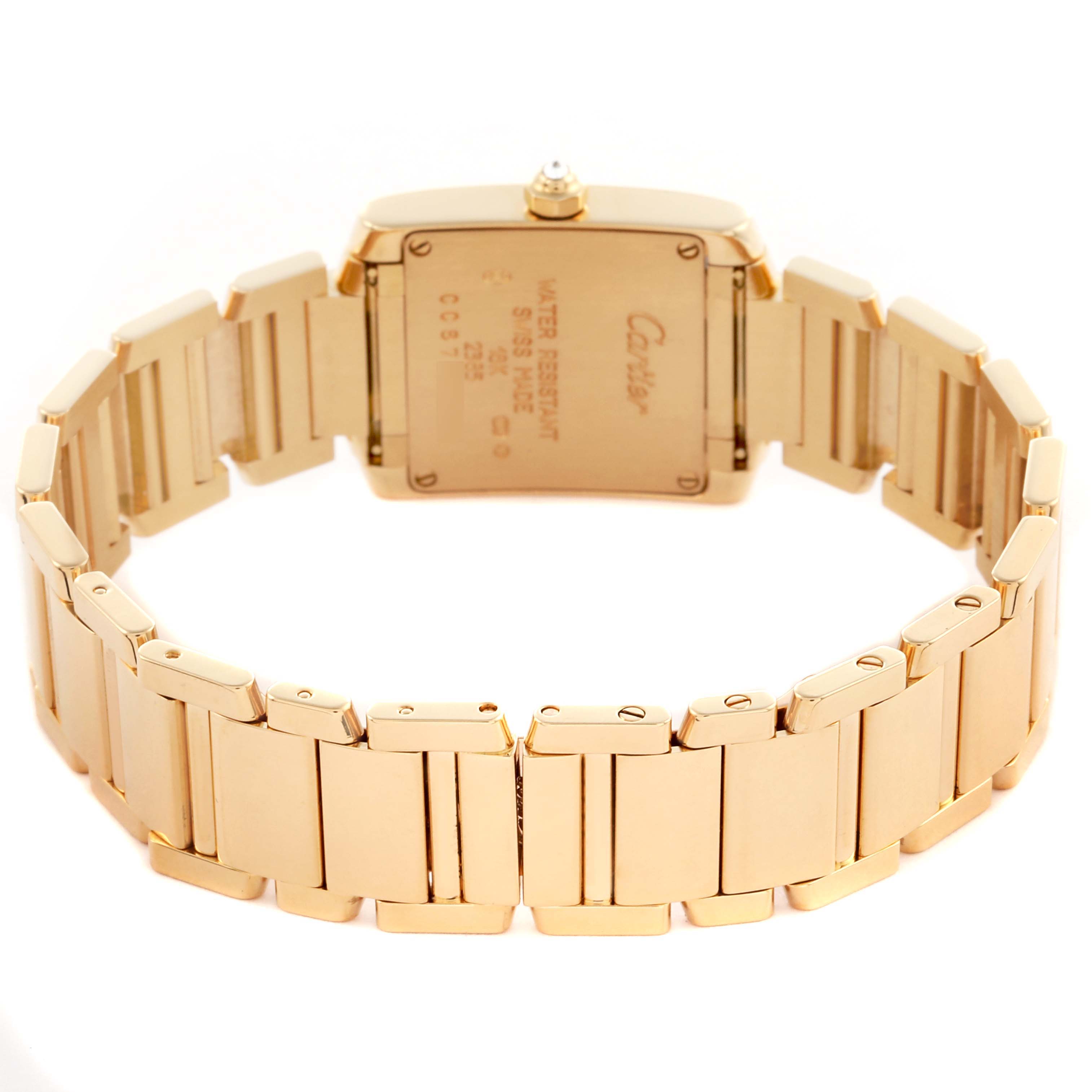 The Tank Française by Cartier is shown from the back, highlighting the bracelet and the watch case.