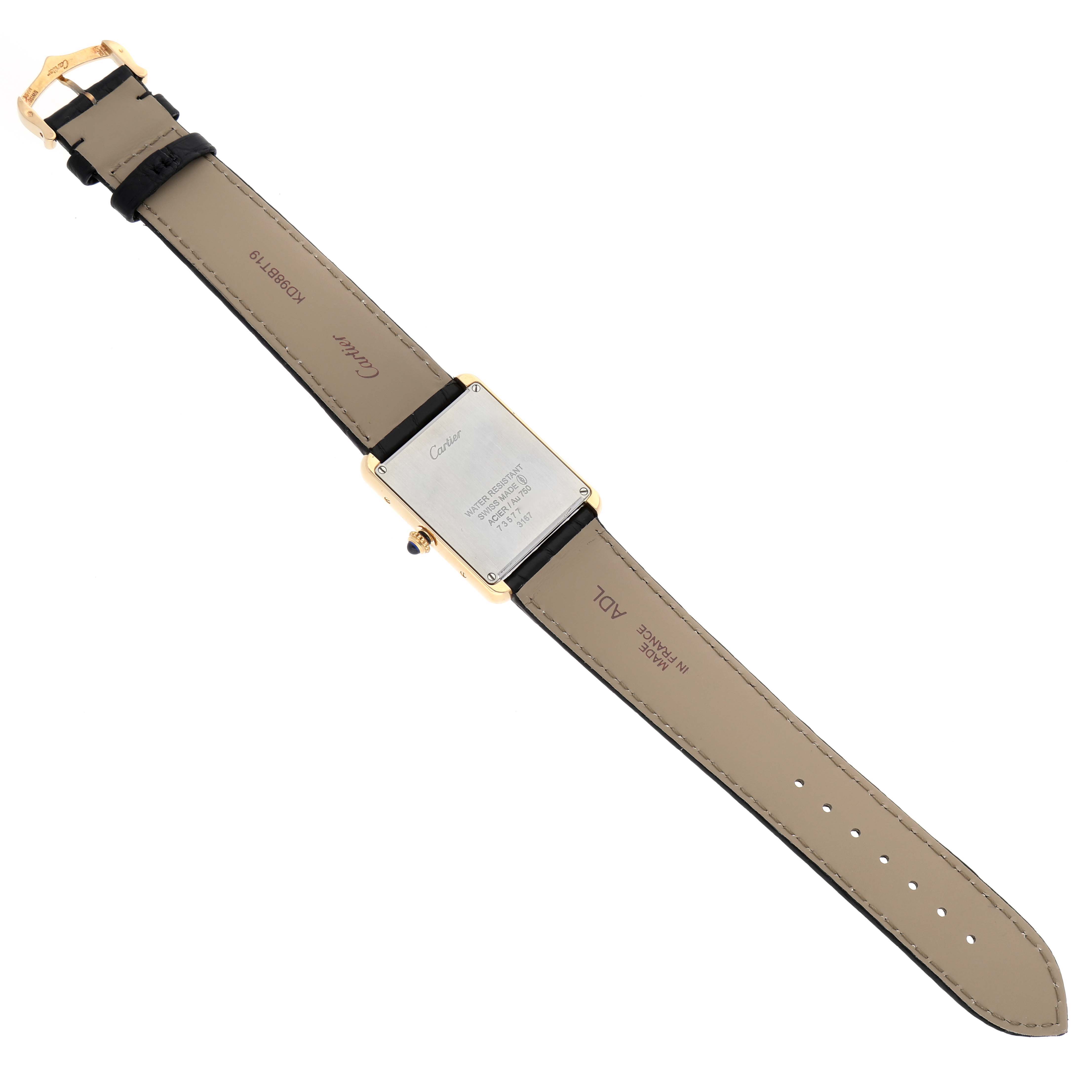 The image shows the back view of the Cartier Tank Solo W5200004 Men
s Steel and Gold (two tone) Silver Dial W5200004 Men
s Steel and Gold (two tone) Silver Dial watch, highlighting its case back and leather strap.