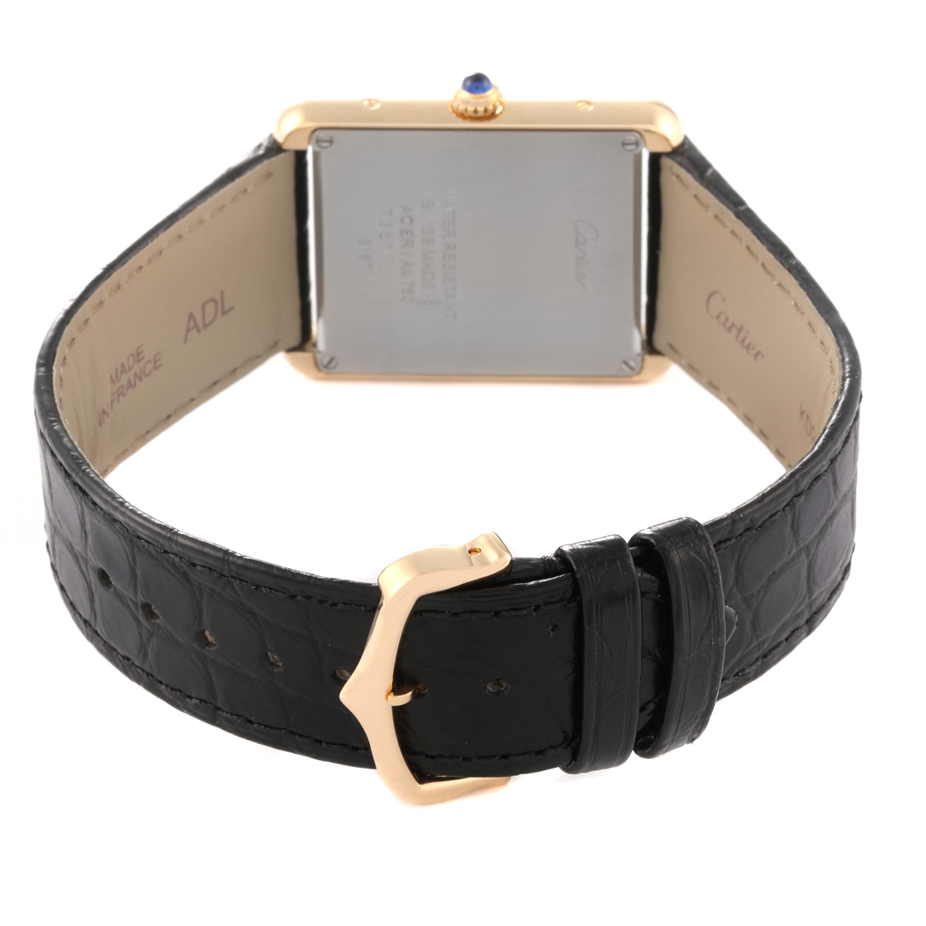 The image shows the back view of the Cartier Tank Solo W5200004 Men
s Steel and Gold (two tone) Silver Dial W5200004 Men
s Steel and Gold (two tone) Silver Dial watch, highlighting the buckle, strap, and case back.