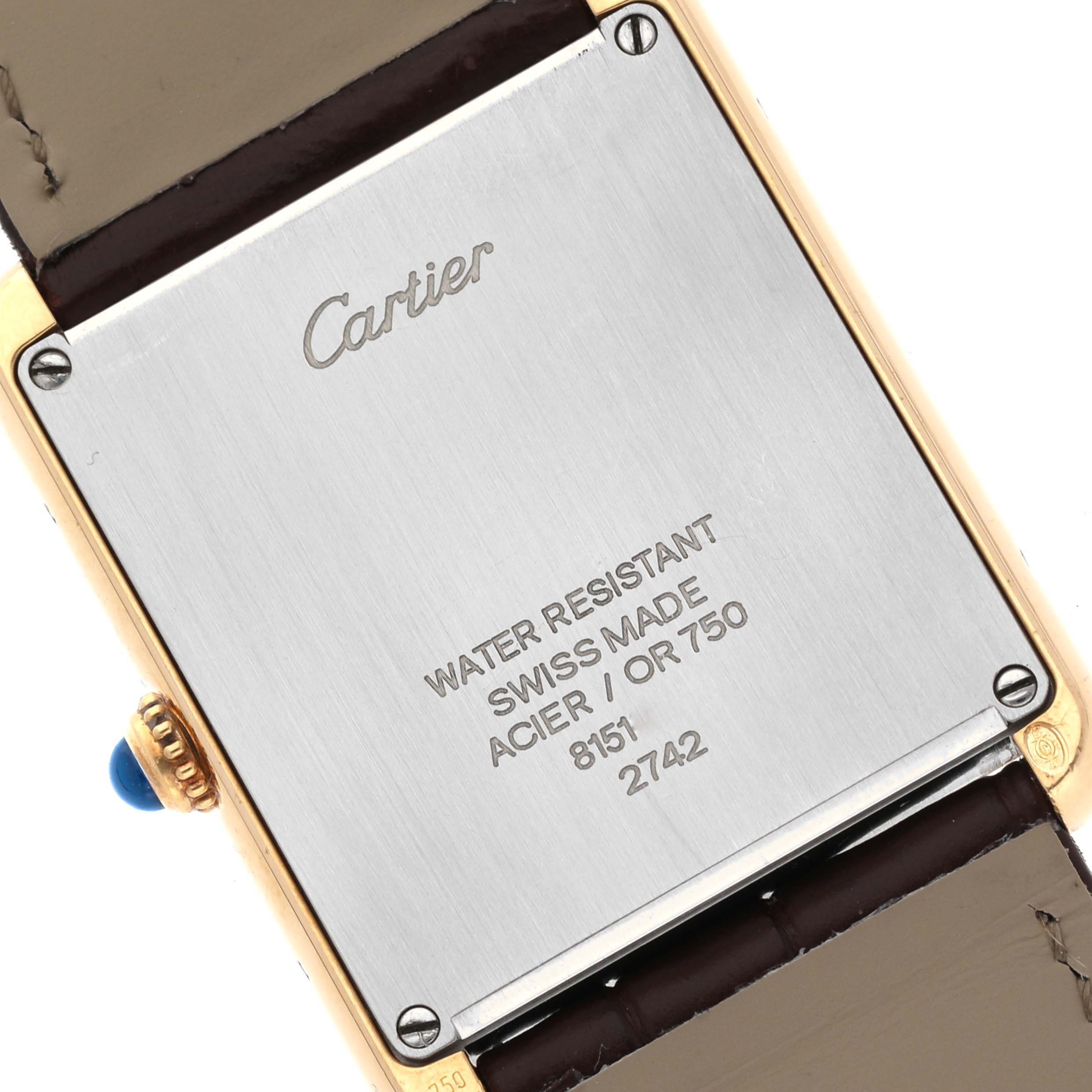 The image shows the back case of a Cartier Tank Solo W1018855 Men
s Steel and Gold (two tone) Silver Dial W1018855 Men
s Steel and Gold (two tone) Silver Dial watch, highlighting engravings and details.