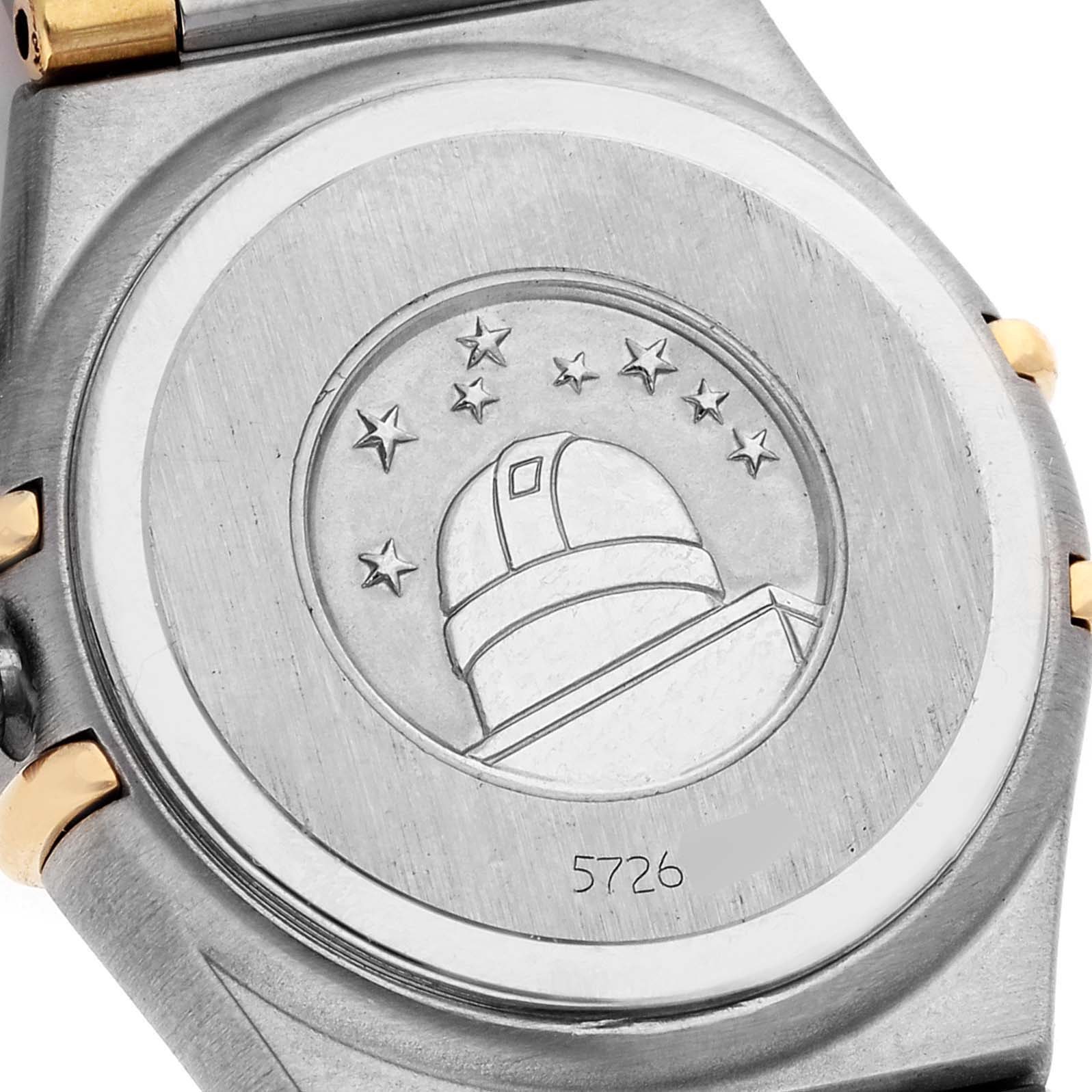 This image shows the engraved case back of the Omega 1367.75.00 Women
s Steel and Gold (two tone) Mother of Pearl Dial 1367.75.00 Women
s Steel and Gold (two tone) Mother of Pearl Dial Constellation Steel Yellow Gold Diamond Ladies 1367.75.00 Box Card model.