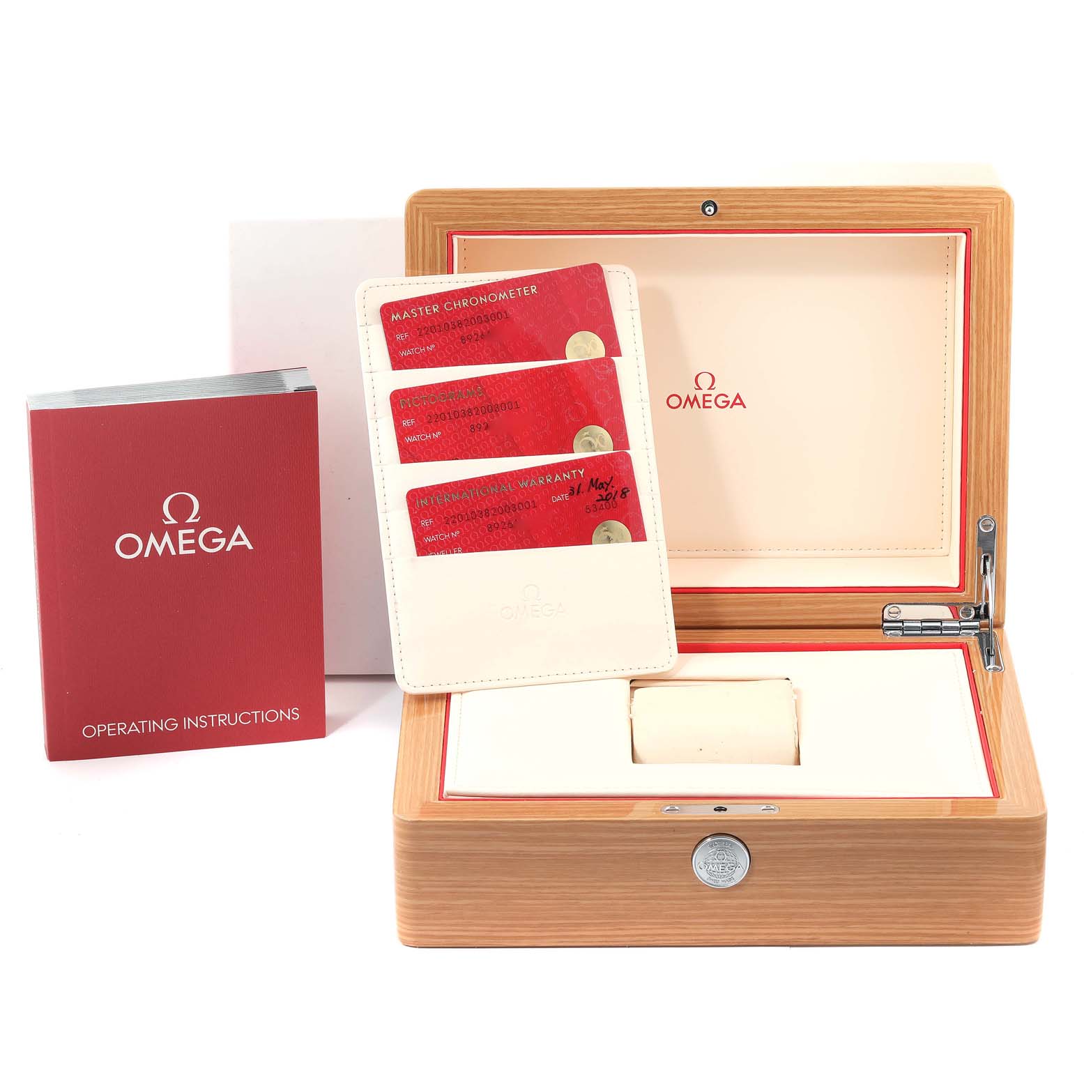 The image shows the Omega Aqua Terra 220.10.38.20.03.001 Men
s Stainless Steel Blue Dial 220.10.38.20.03.001 Men
s Stainless Steel Blue Dial watch box, warranty cards, and operating instructions from a frontal angle.