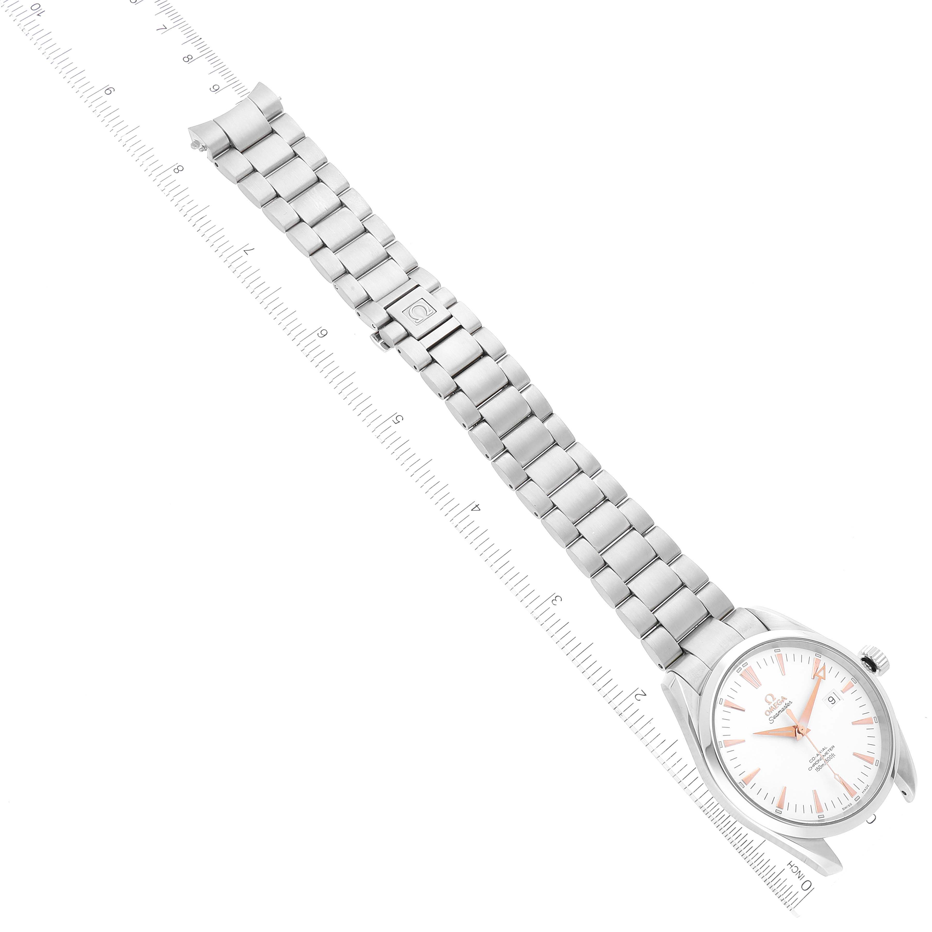 The image shows a top-down view of an Omega Aqua Terra 2502.34.00 Men's Stainless Steel Silver Dial 2502.34.00 Men's Stainless Steel Silver Dial watch, including the dial, case, and metal bracelet next to a ruler.