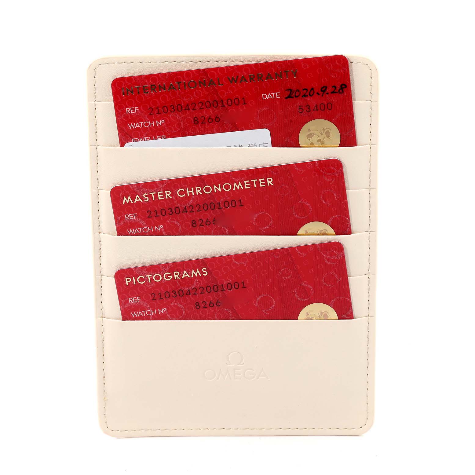 The image shows warranty cards for the Omega Seamaster 210.30.42.20.01.001 Men's Stainless Steel Black Dial 210.30.42.20.01.001 Men's Stainless Steel Black Dial watch in a beige cardholder.