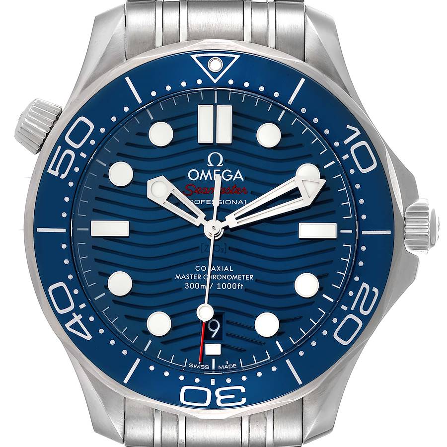 The watch, an Omega Seamaster model, is shown from a front angle highlighting the blue dial, bezel, and stainless steel bracelet.