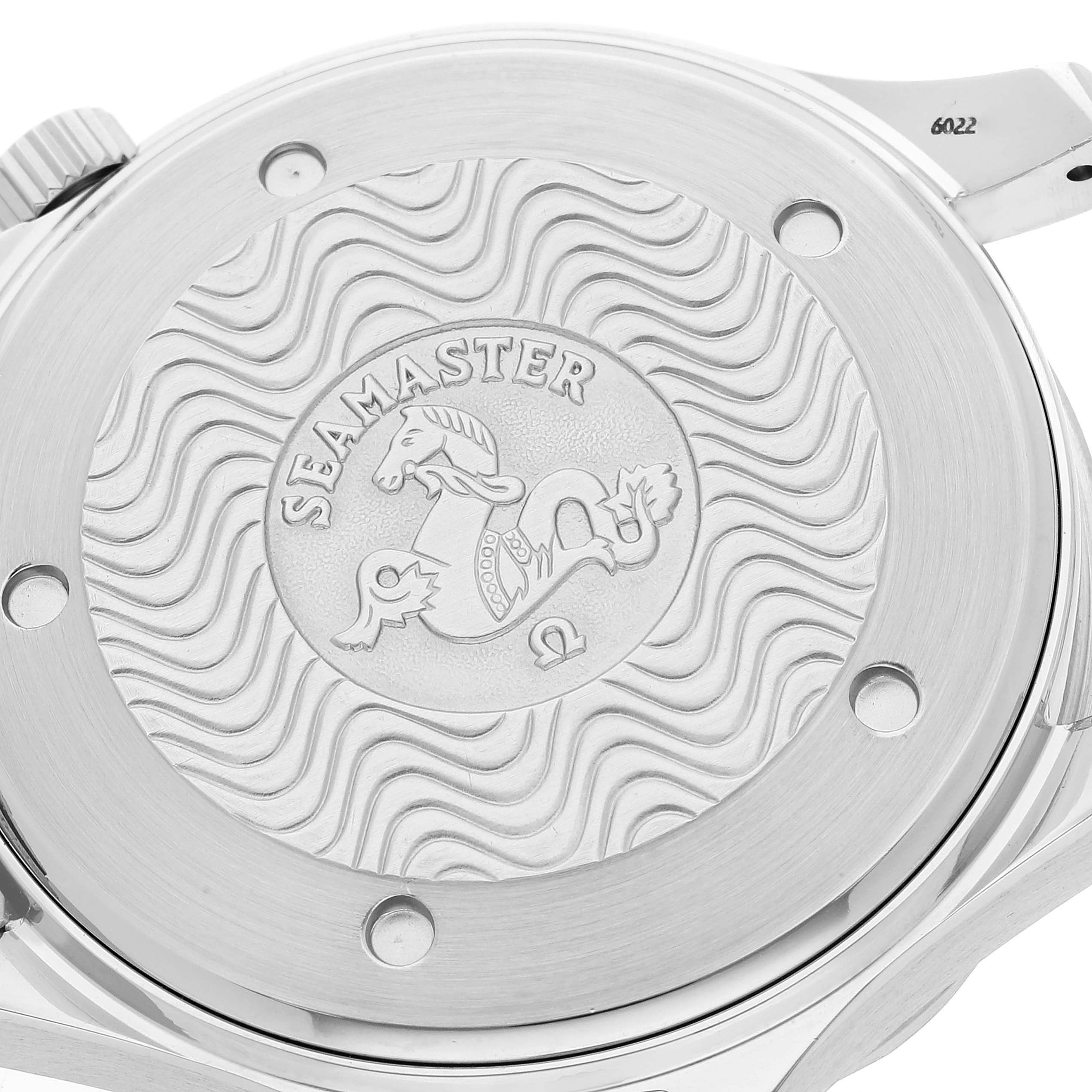 This is a close-up of the case back of the Omega Seamaster 2531.80.00 Men's Stainless Steel Blue Dial 2531.80.00 Men's Stainless Steel Blue Dial watch, showcasing its engravings and wave pattern design.