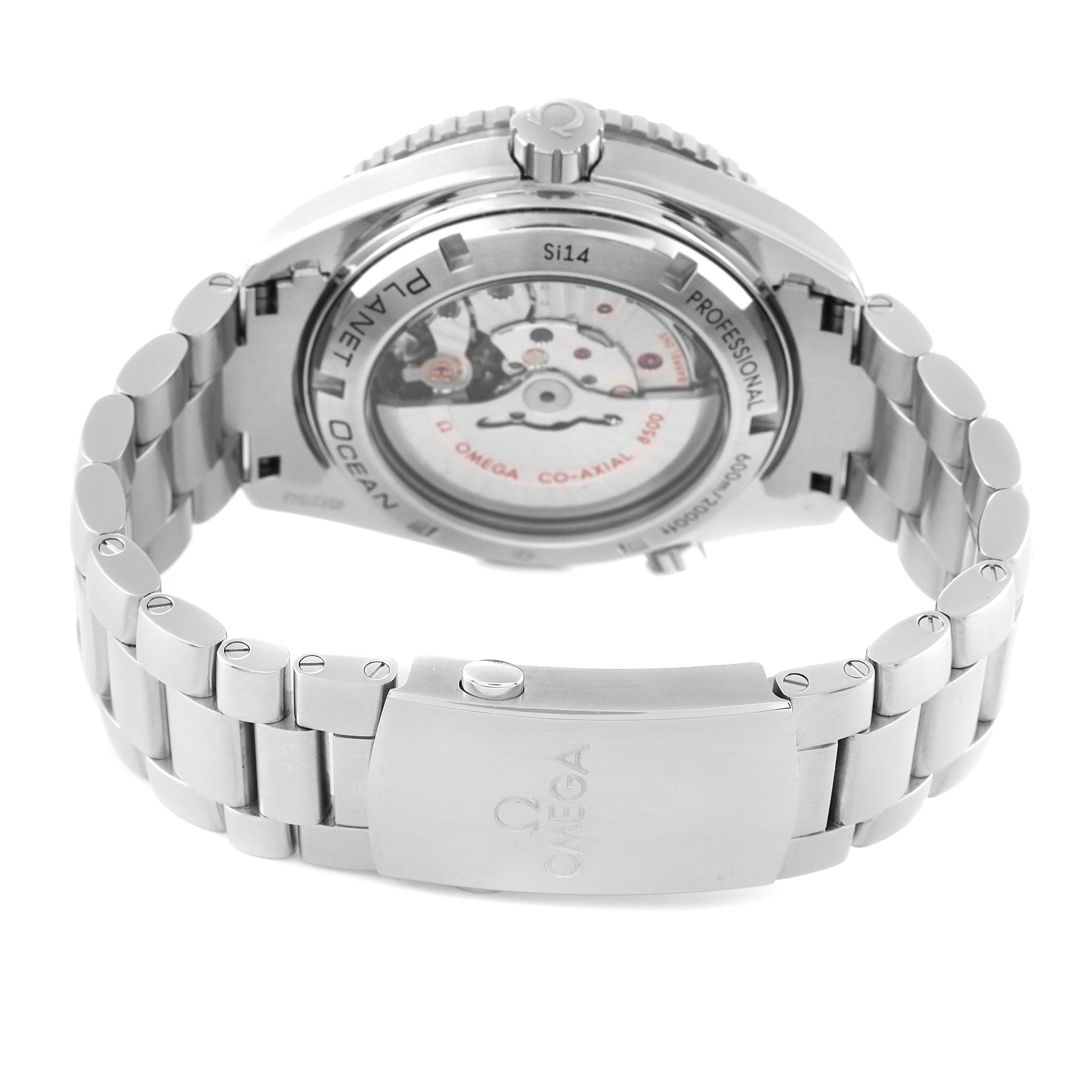 The image shows the back view of the Omega Planet Ocean 232.30.46.21.01.001 Men
s Stainless Steel Black Dial 232.30.46.21.01.001 Men
s Stainless Steel Black Dial watch, highlighting its movement and bracelet clasp.