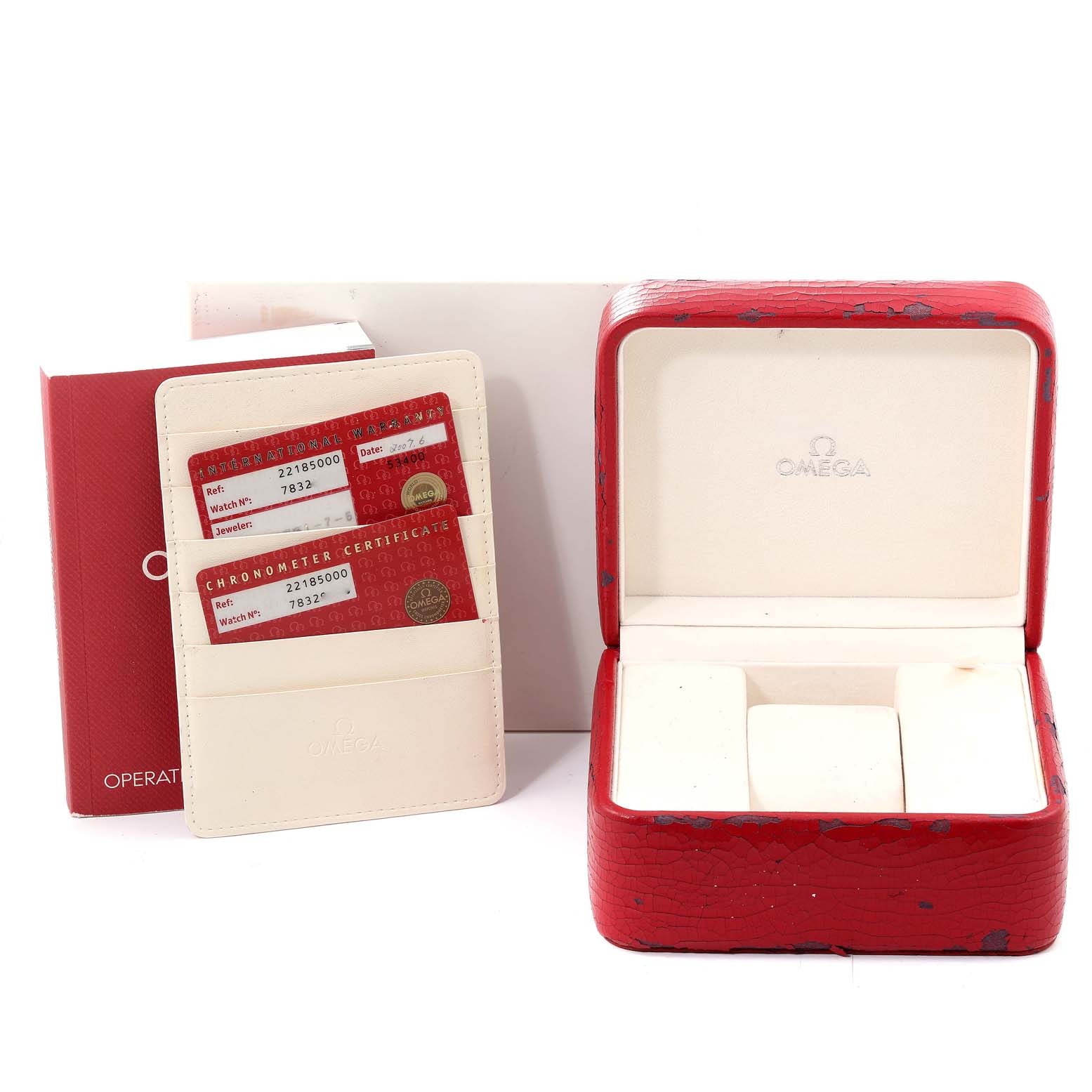 The image shows accessories for the Omega Planet Ocean 2218.50.00 Men
s Stainless Steel Black Dial 2218.50.00 Men
s Stainless Steel Black Dial watch, including the warranty cards, instruction manual, and the opened watch case.