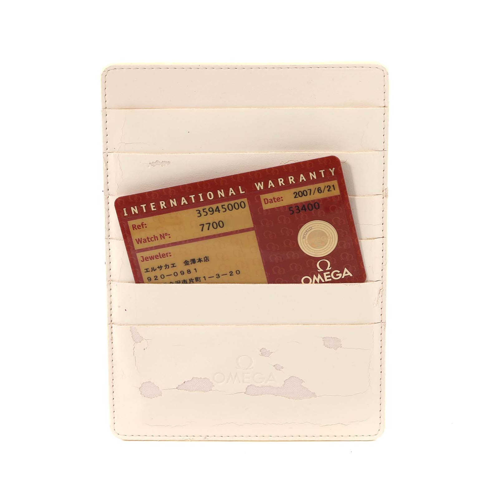 The image shows an Omega Speedmaster 3594.50.00 Men
s Stainless Steel Black Dial 3594.50.00 Men
s Stainless Steel Black Dial International Warranty card within a protective card holder.