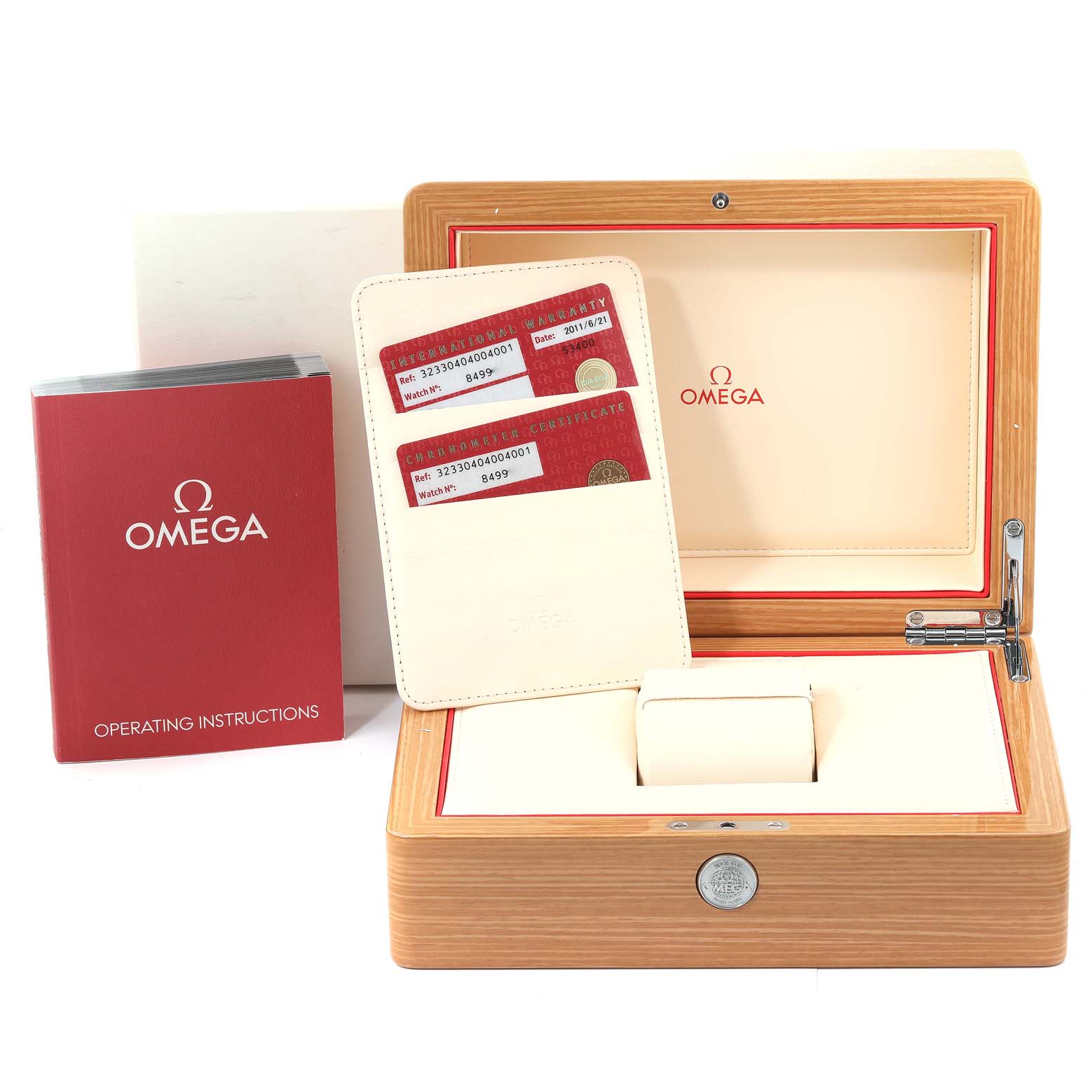 The image shows an Omega Speedmaster 323.30.40.40.04.001 Men's Stainless Steel White Dial 323.30.40.40.04.001 Men's Stainless Steel White Dial watch box, warranty cards, and operating instructions from a front angle.