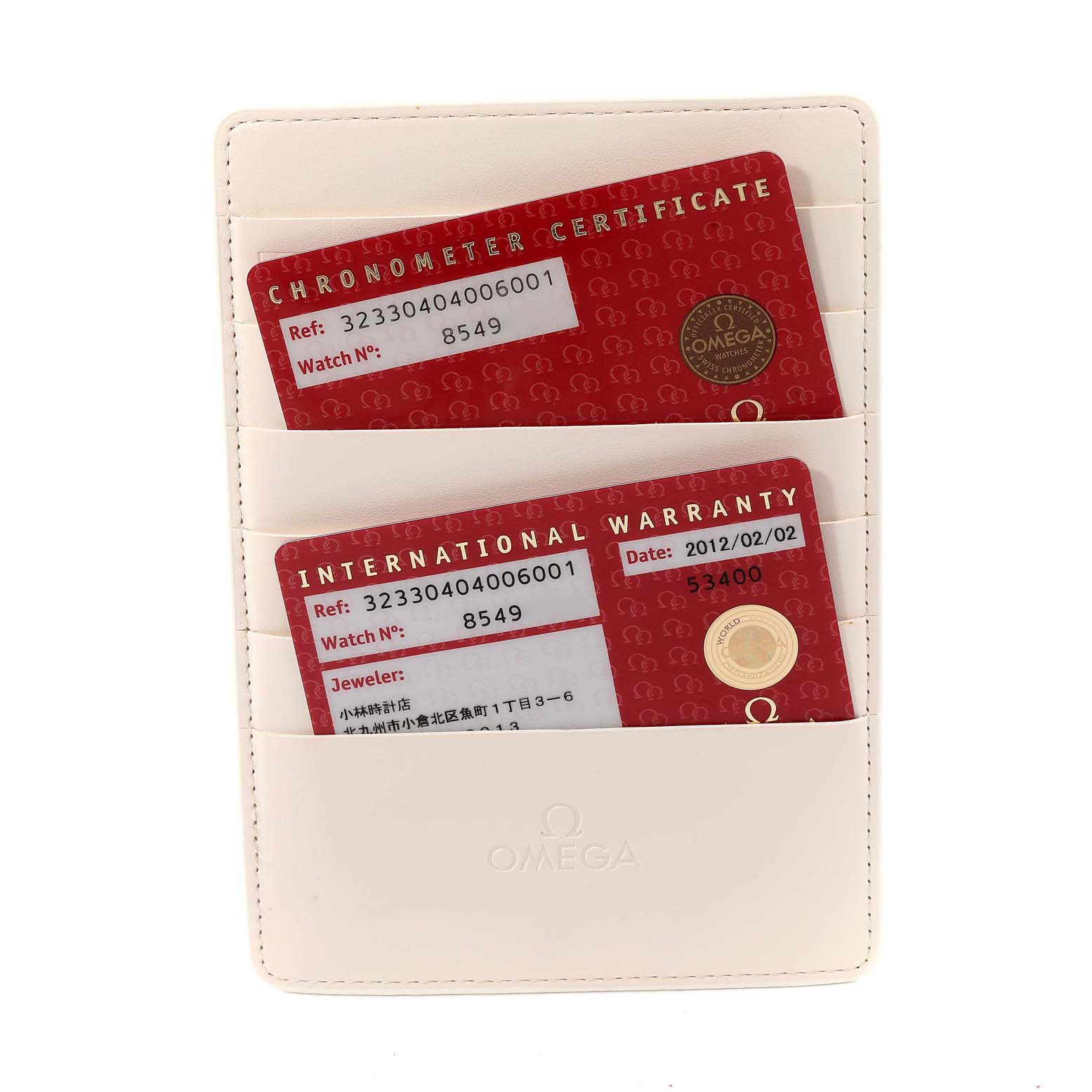 This image shows the warranty and chronometer certificate cards for the Omega Speedmaster 323.30.40.40.06.001 Men's Stainless Steel Grey Dial 323.30.40.40.06.001 Men's Stainless Steel Grey Dial model at a straight-on angle.