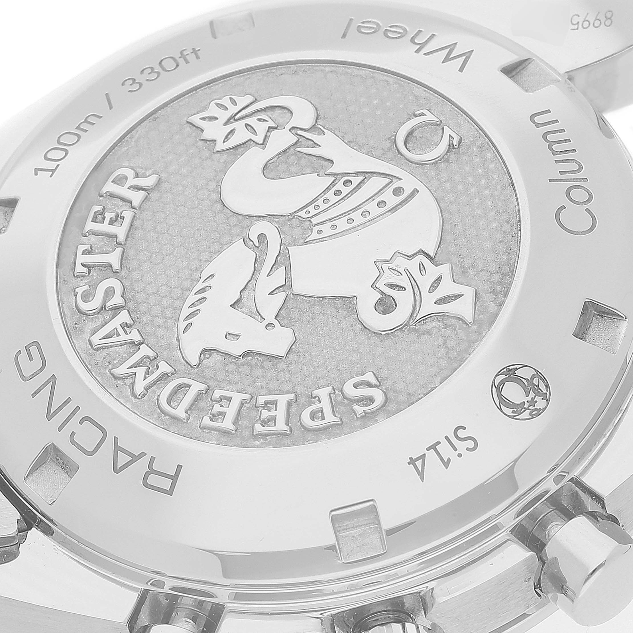 The image shows the back case of an Omega Speedmaster 326.30.40.50.03.001 Men's Stainless Steel Blue Dial 326.30.40.50.03.001 Men's Stainless Steel Blue Dial Racing watch, highlighting its engravings and medallion.