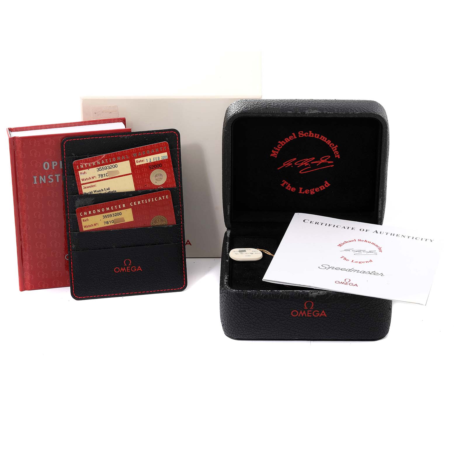 The image shows the accessories for an Omega Speedmaster 3559.32.00 Men's Stainless Steel Silver Dial 3559.32.00 Men's Stainless Steel Silver Dial watch, including a box, warranty cards, certificate of authenticity, and instruction manual.