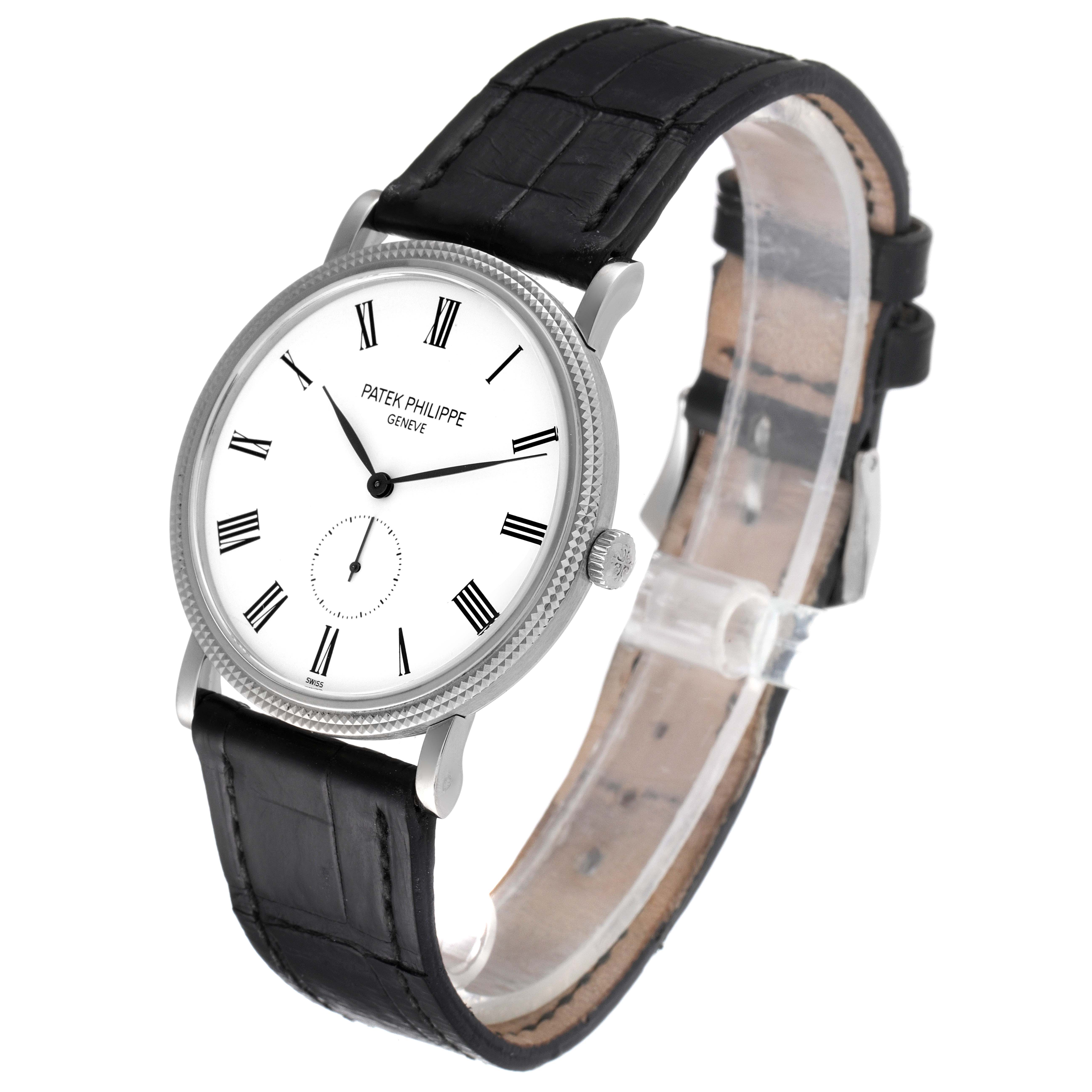 This image shows a Patek Philippe Calatrava 5119G Men's White Gold White Dial 5119G Men's White Gold White Dial watch angled from the front with a black leather strap and a white dial with Roman numerals.