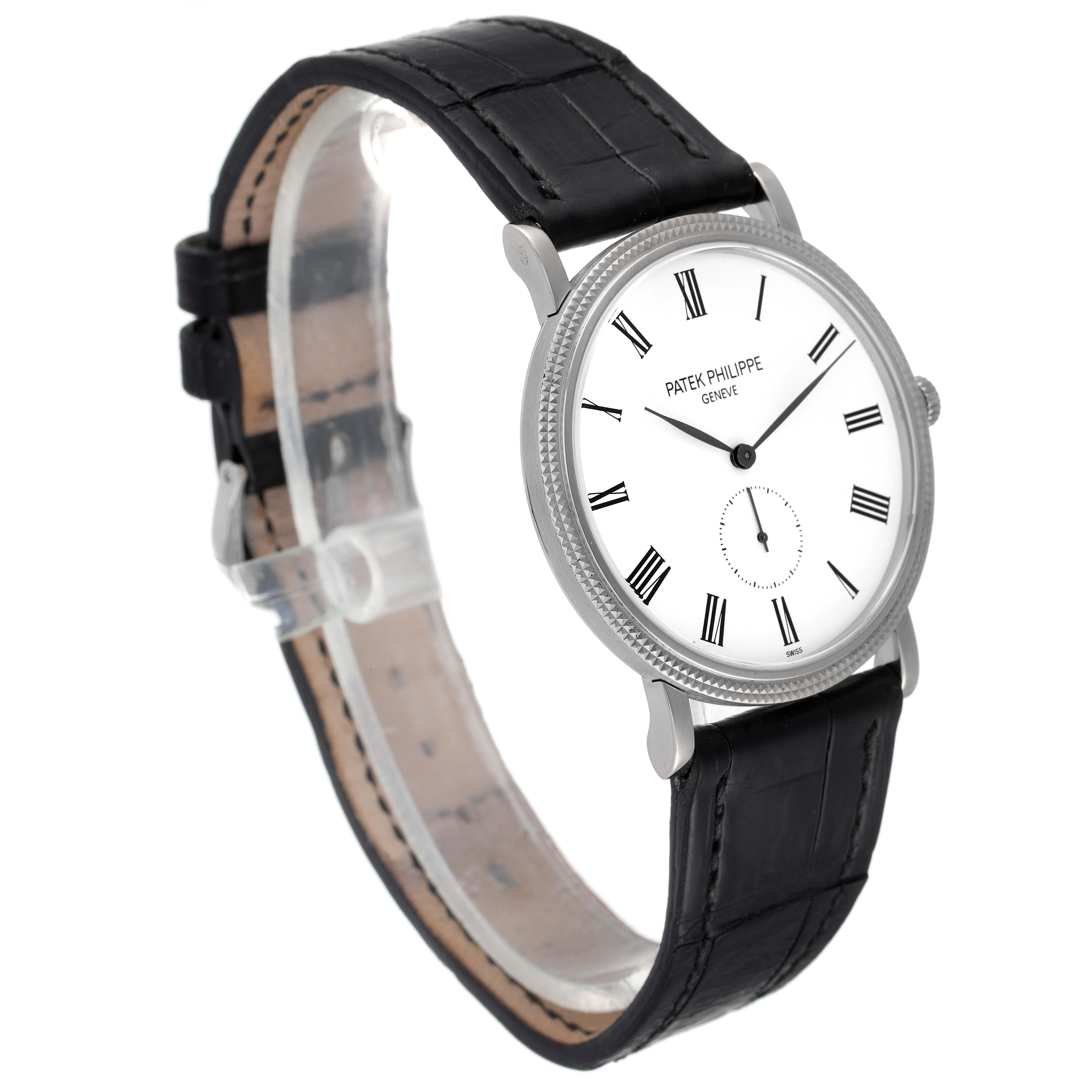 This image shows a Patek Philippe Calatrava 5119G Men's White Gold White Dial 5119G Men's White Gold White Dial watch at a three-quarter angle, highlighting its dial, bezel, and leather strap.
