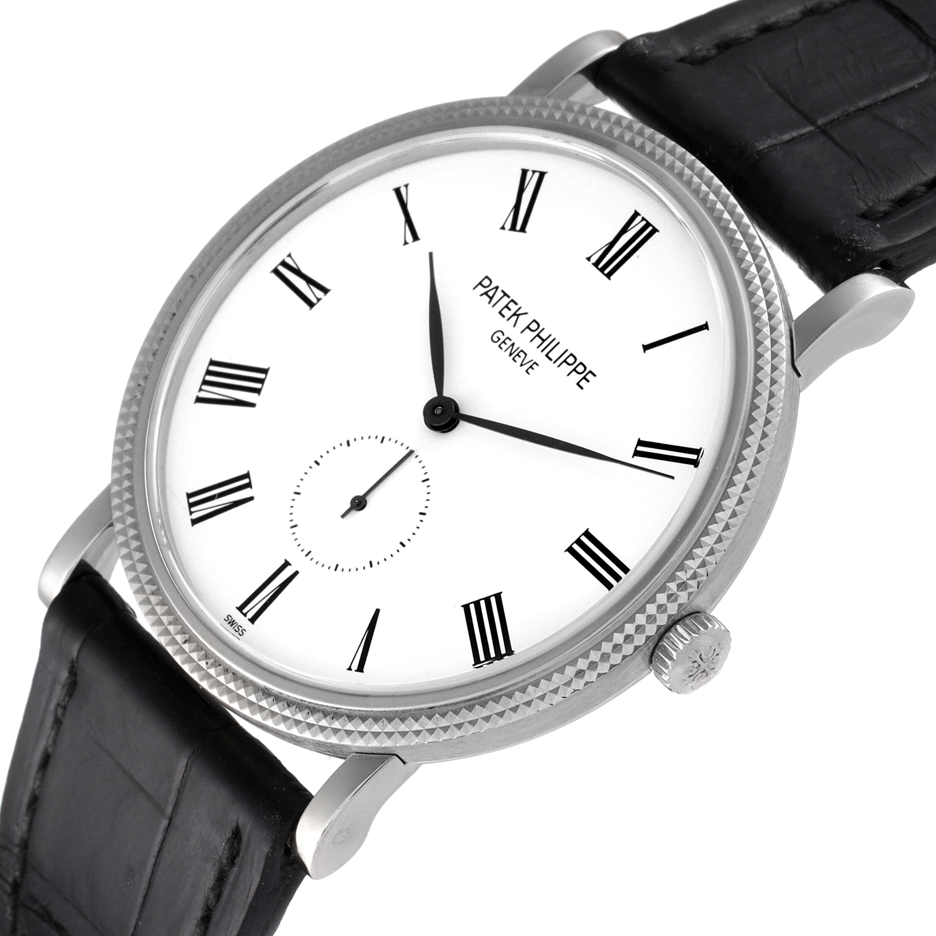 The image shows a front angle view of a Patek Philippe Calatrava 5119G Men's White Gold White Dial 5119G Men's White Gold White Dial watch face and part of the black leather strap.