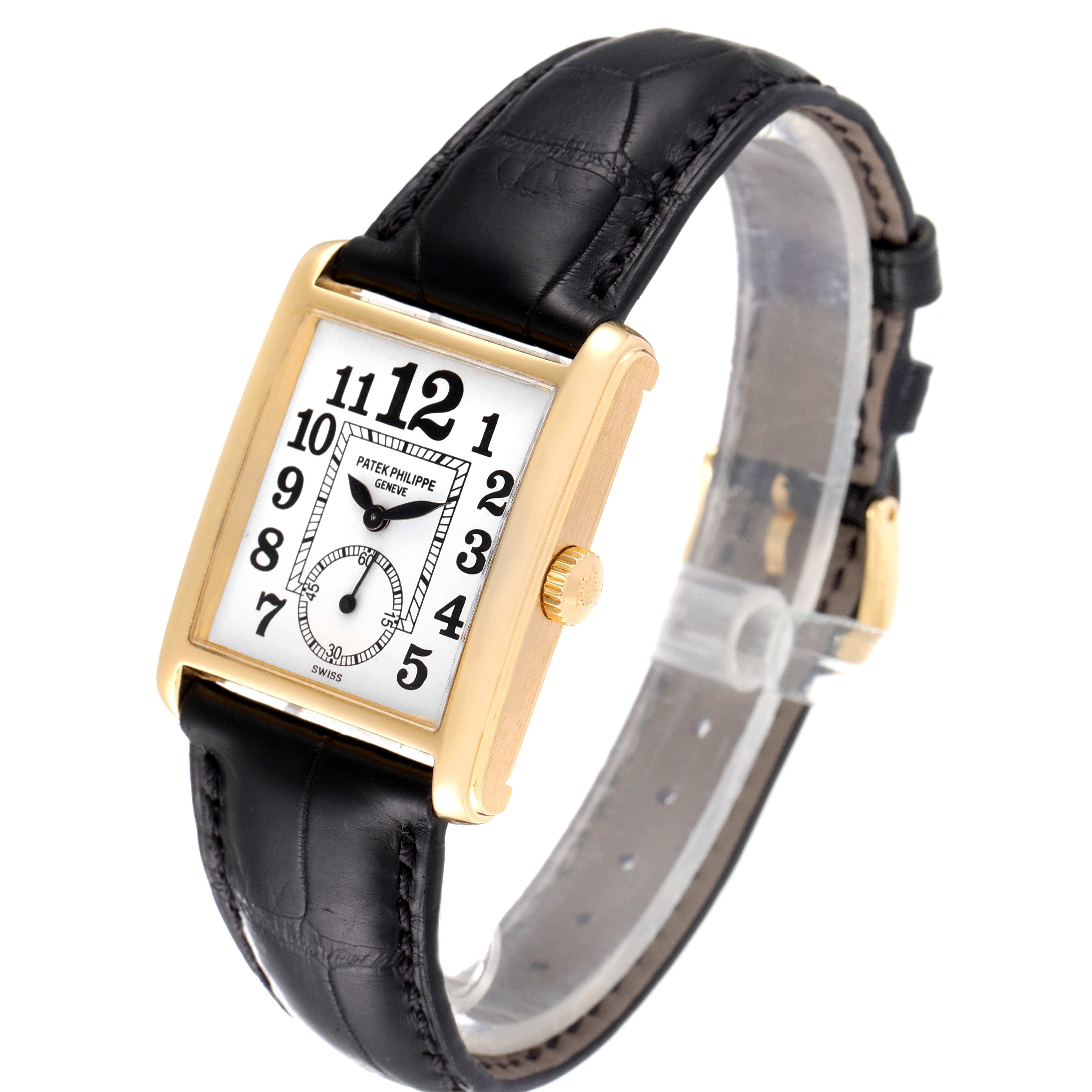 The Patek Philippe Gondolo 5014J Men's Yellow Gold White Dial 5014J Men's Yellow Gold White Dial watch is shown at a slight angle, displaying its rectangular dial, gold case, and black leather strap.