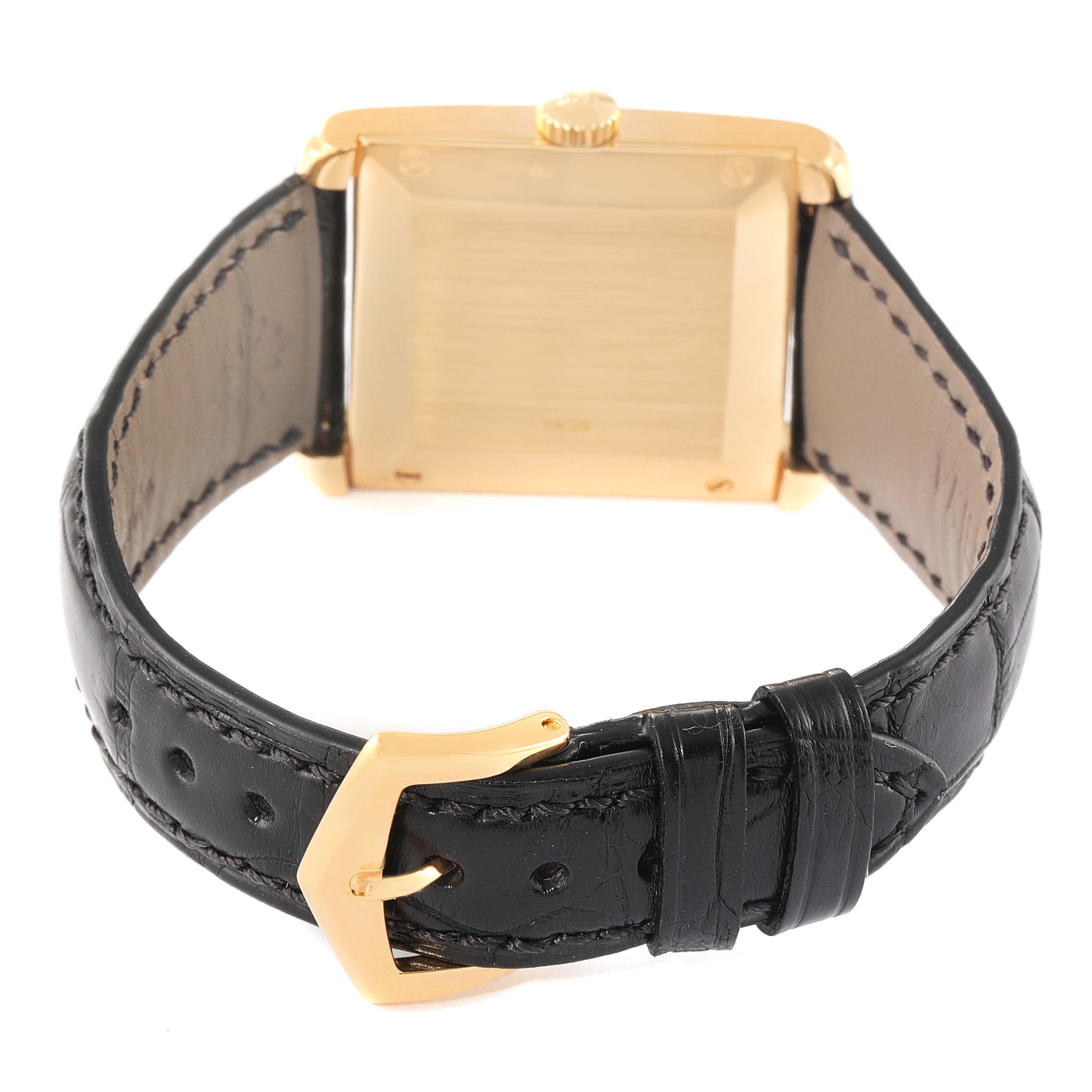 This image shows the back of the Patek Philippe Gondolo 5014J Men's Yellow Gold White Dial 5014J Men's Yellow Gold White Dial watch, featuring its leather strap and gold buckle.