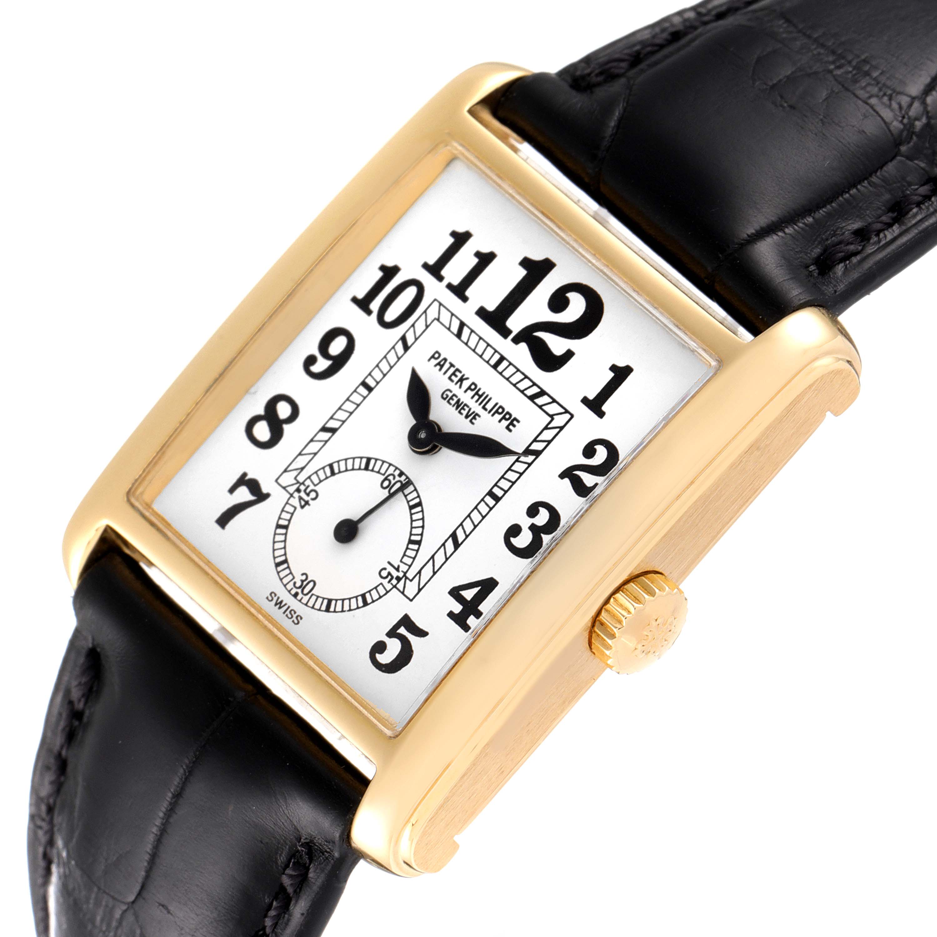 This image shows a Patek Philippe Gondolo 5014J Men's Yellow Gold White Dial 5014J Men's Yellow Gold White Dial watch from a slightly tilted top view, highlighting its face, case, crown, and leather strap.