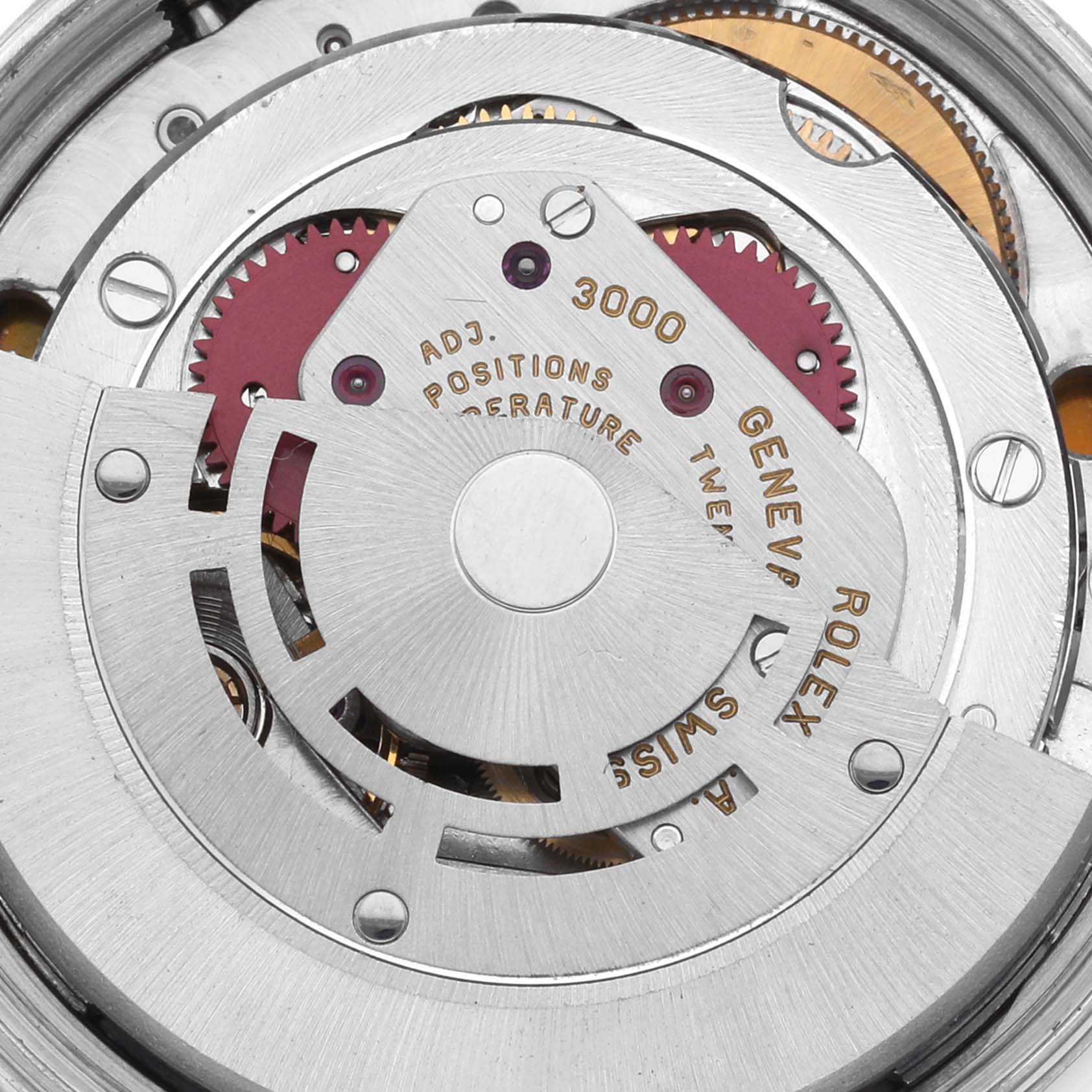 The image shows a close-up of the Rolex Air-King 14010 Men's Stainless Steel Blue Dial 14010 Men's Stainless Steel Blue Dial's intricate movement from the back, highlighting gears and engravings.