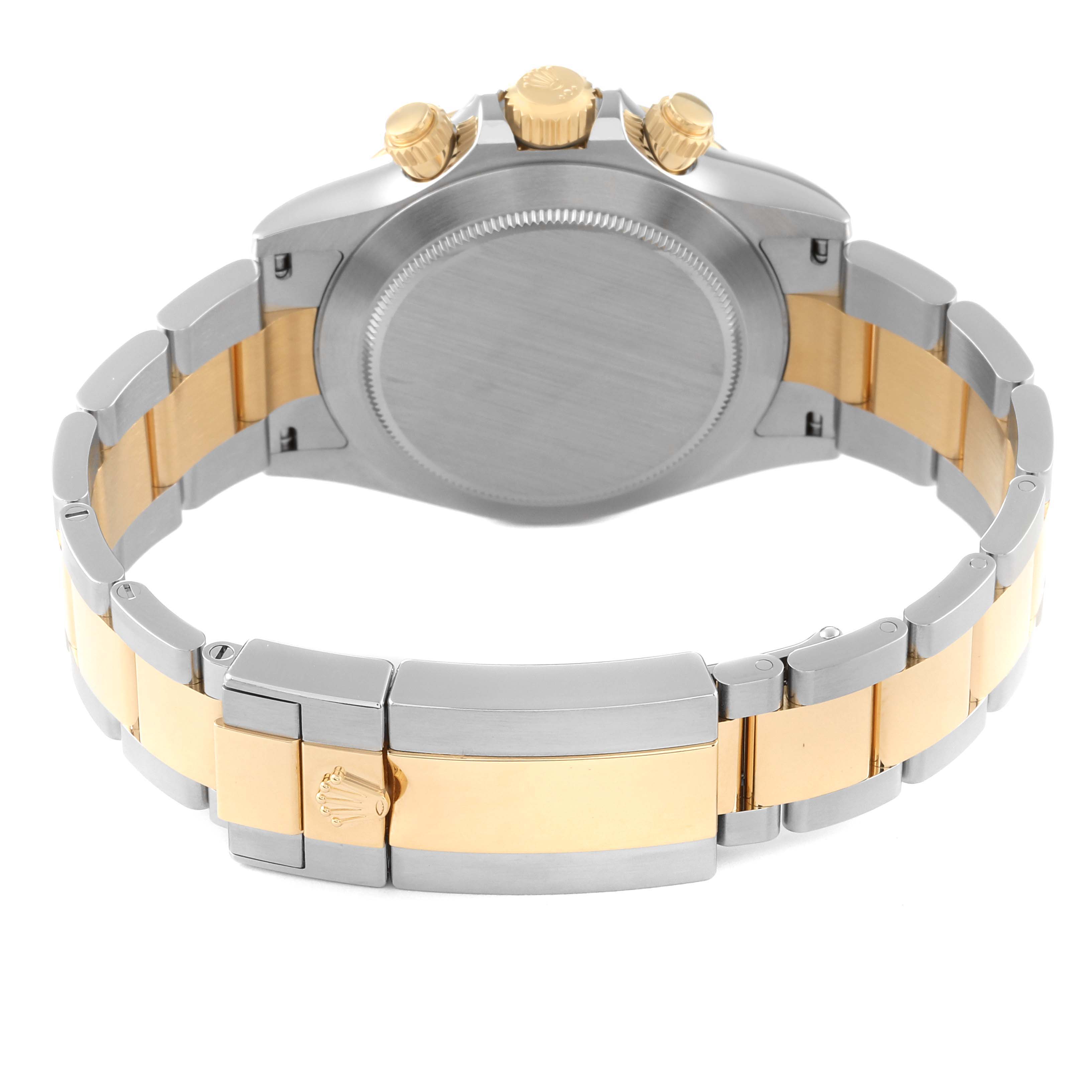 This image shows the back case, crown, and bracelet of a Rolex Daytona 116503 Men
s Steel and Gold (two tone) Black Dial 116503 Men
s Steel and Gold (two tone) Black Dial watch in a two-tone metal finish.