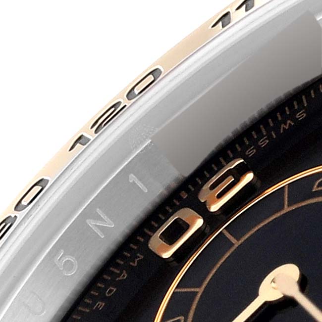 This image shows a close-up of the bezel and dial of a Rolex Daytona 116503 Men
s Steel and Gold (two tone) Black Dial 116503 Men
s Steel and Gold (two tone) Black Dial watch.