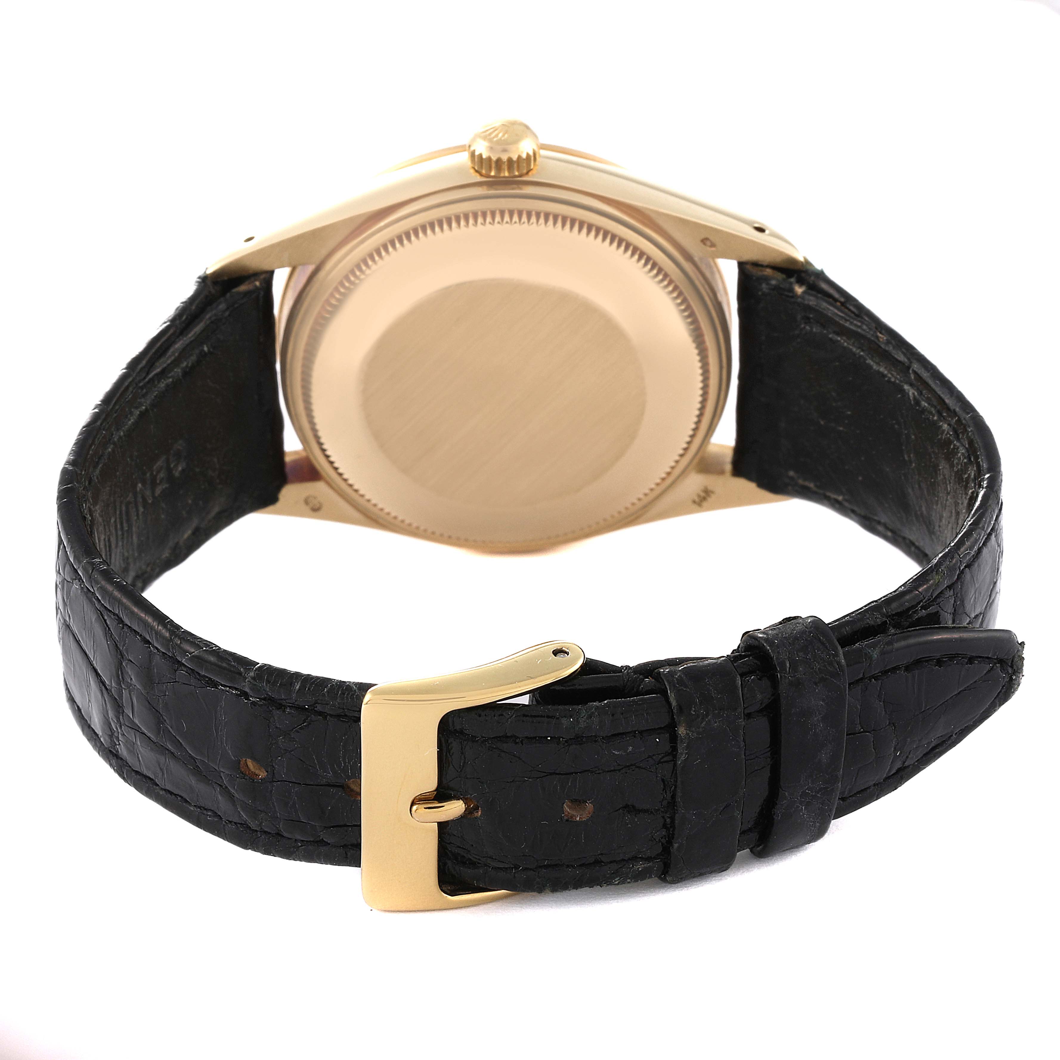 The image shows the back view and strap of a Rolex Vintage Collection 15007 Men's Yellow Gold Champagne Dial 15007 Men's Yellow Gold Champagne Dial watch, emphasizing the case back and black leather strap with a clasp.