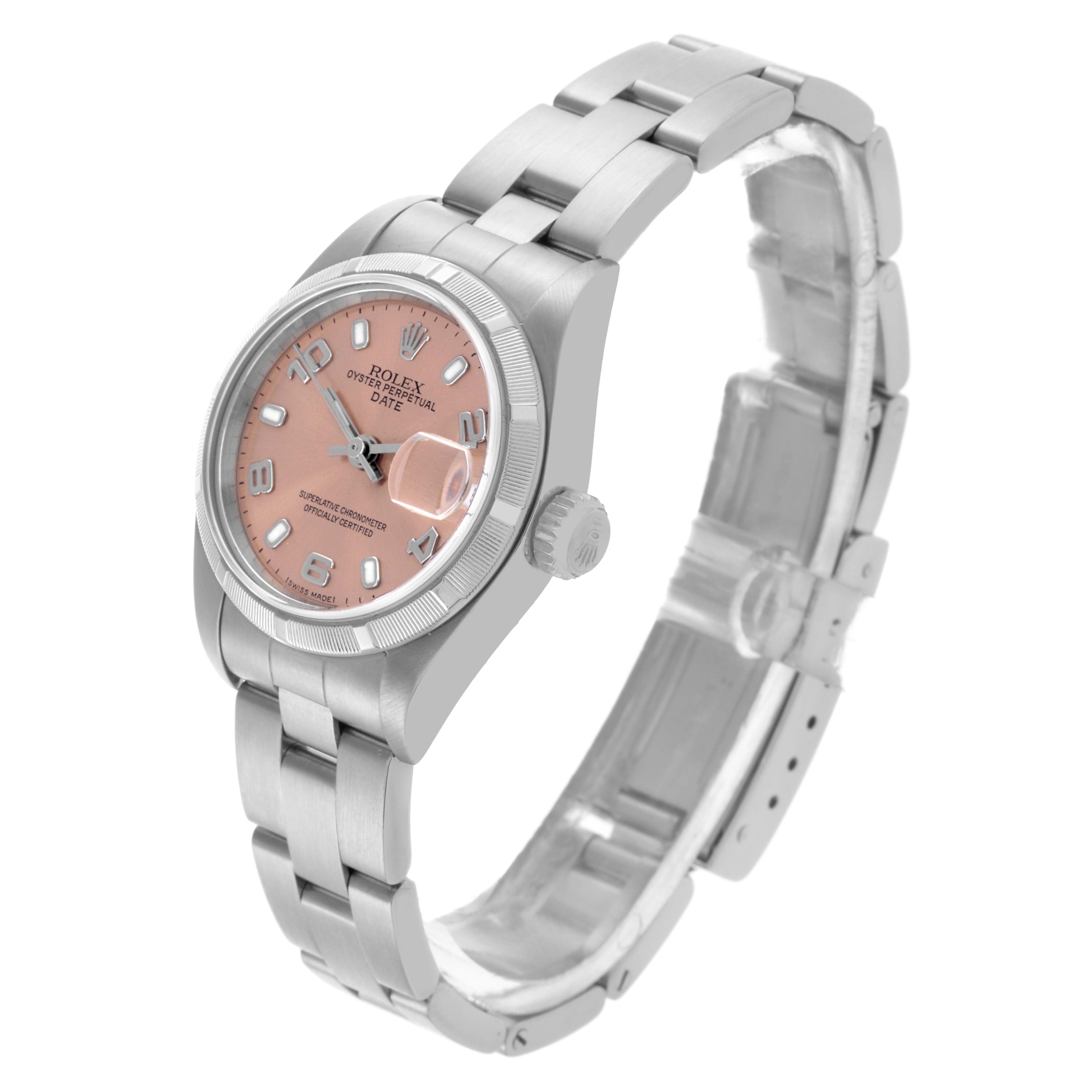 The Rolex Date 79190 Women's Stainless Steel Pink Dial 79190 Women's Stainless Steel Pink Dial watch is angled to show the face, bracelet, and crown from a slightly elevated side perspective.