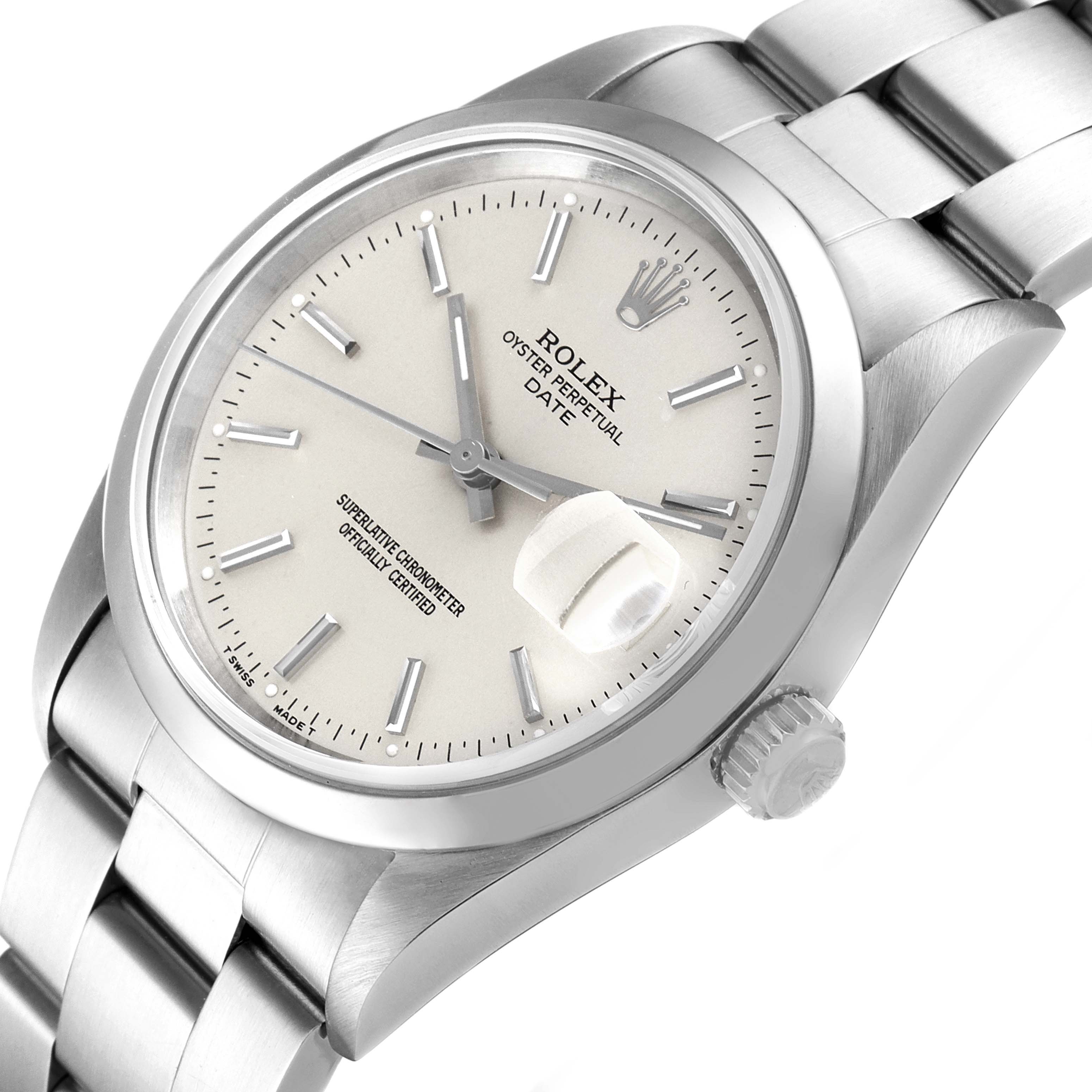 The image shows the dial, bezel, crown, and bracelet of a Rolex Oyster Perpetual Date model at an angled close-up.