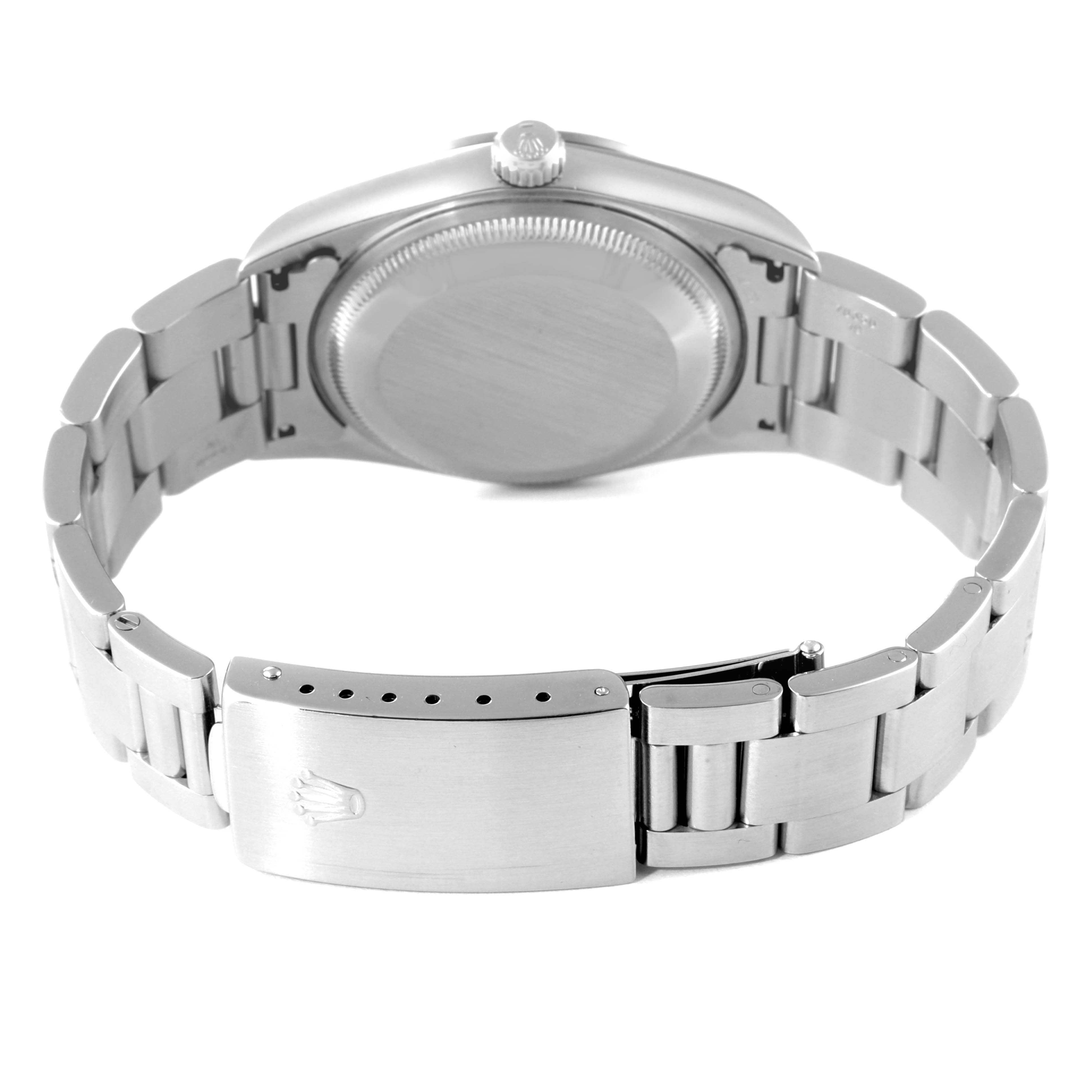 The image shows the backside of a Rolex Date 15200 Men's Stainless Steel Silver Dial 15200 Men's Stainless Steel Silver Dial model watch, focusing on the case back and the bracelet with its clasp.