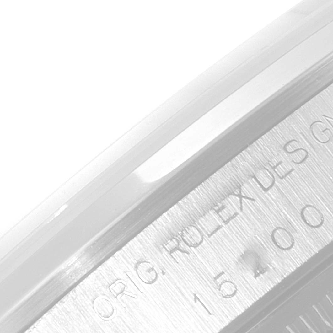 The image shows a close-up angle of the engraved edge on a Rolex Date 15200 Men's Stainless Steel Silver Dial 15200 Men's Stainless Steel Silver Dial model watch, featuring part of the brand's name and original design details.