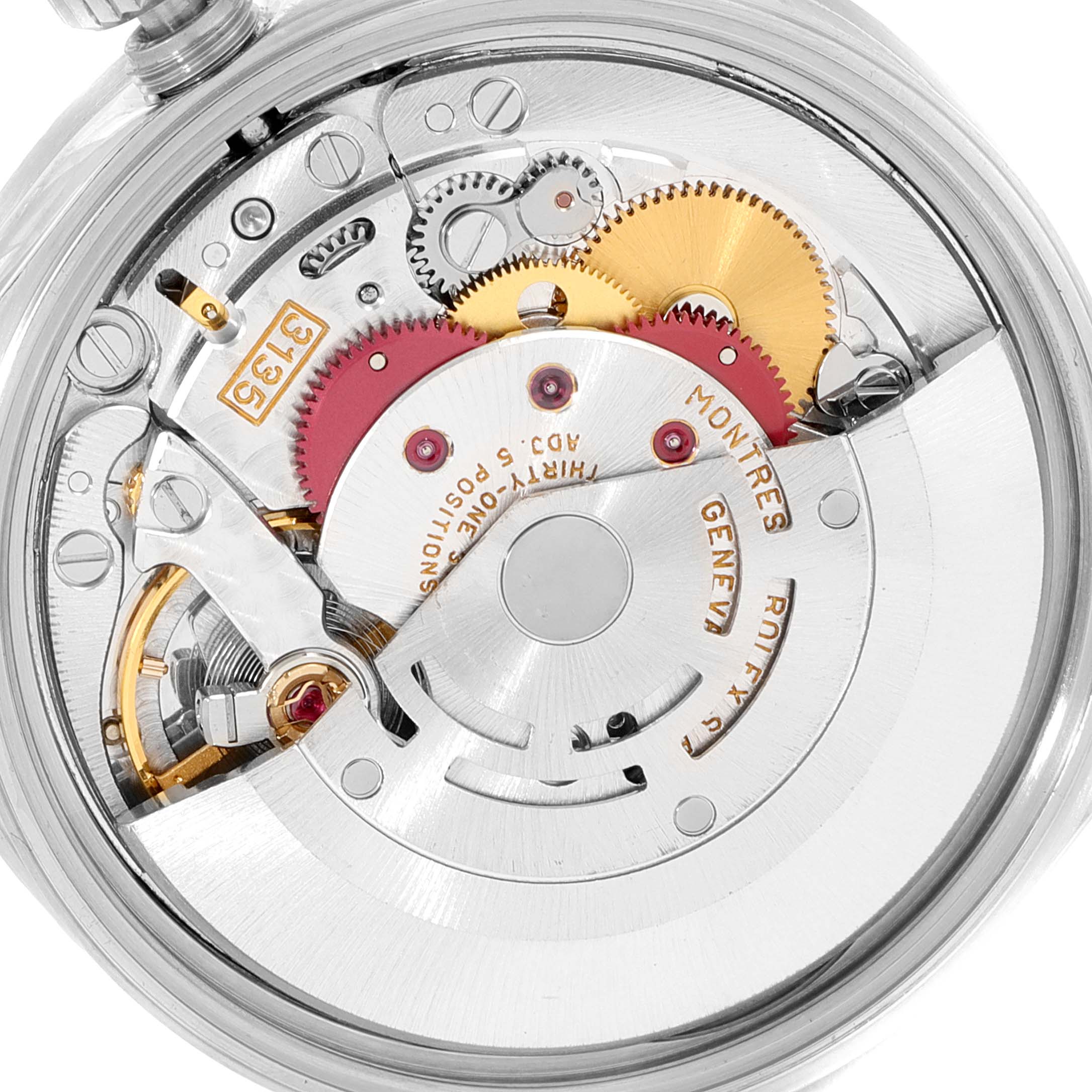 This close-up image shows the internal mechanical movement of a Rolex Date 15210 Men's Stainless Steel Silver Dial 15210 Men's Stainless Steel Silver Dial model watch, featuring gears and components.