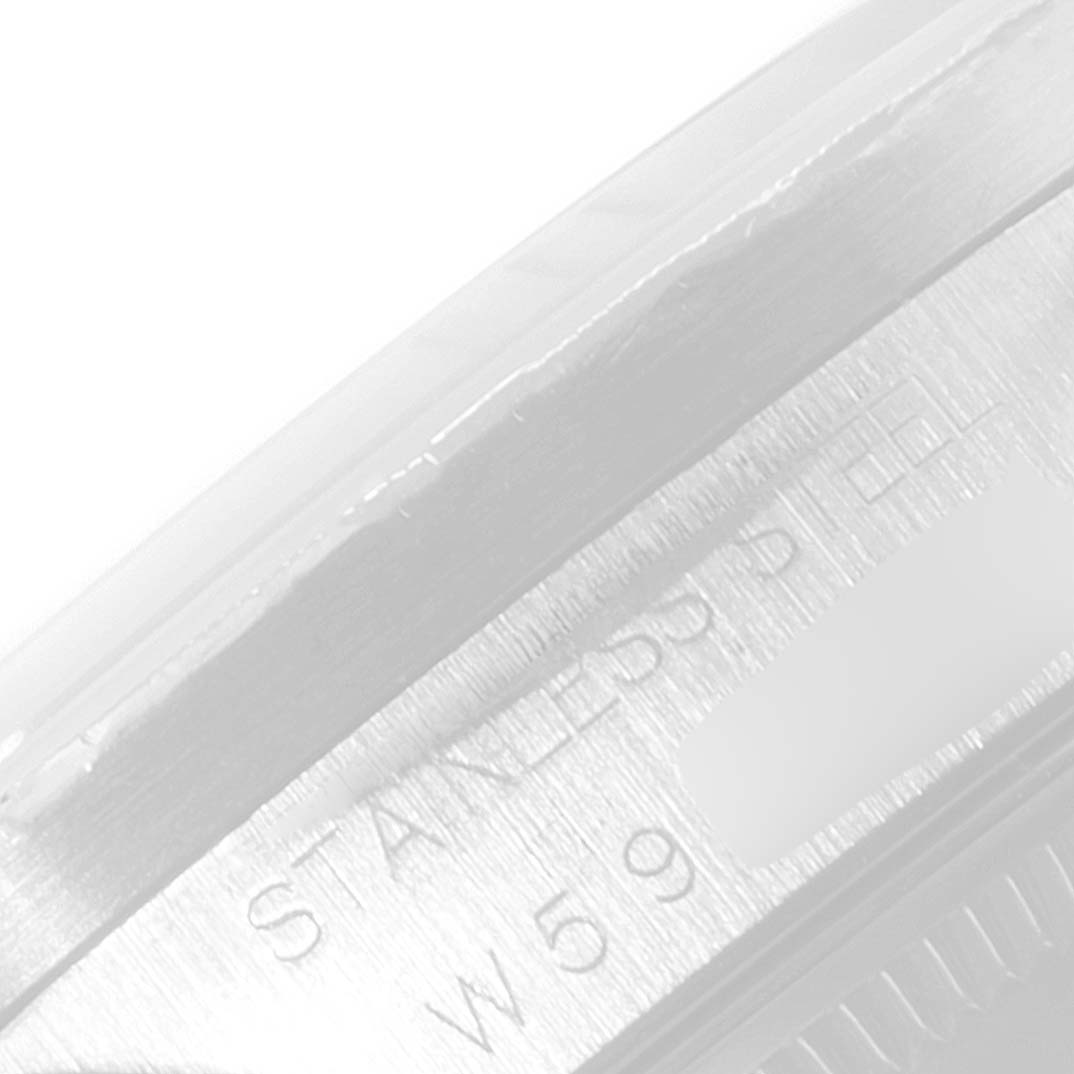 The image shows a close-up angle of the engraved text on the side of a stainless steel Rolex Date 15210 Men's Stainless Steel Silver Dial 15210 Men's Stainless Steel Silver Dial model watch.