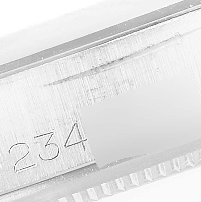 This image shows a close-up angle of the serial number engraved on the side of the case of a Rolex Vintage Collection 1500 Men's Stainless Steel Silver Dial 1500 Men's Stainless Steel Silver Dial watch.