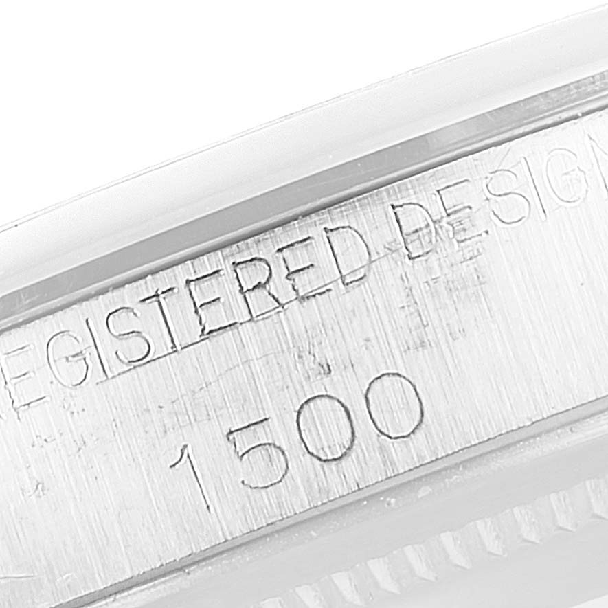 This image shows a close-up of the edge and engraving on the case of a Rolex Vintage Collection 1500 Men's Stainless Steel Silver Dial 1500 Men's Stainless Steel Silver Dial model 1500 watch.