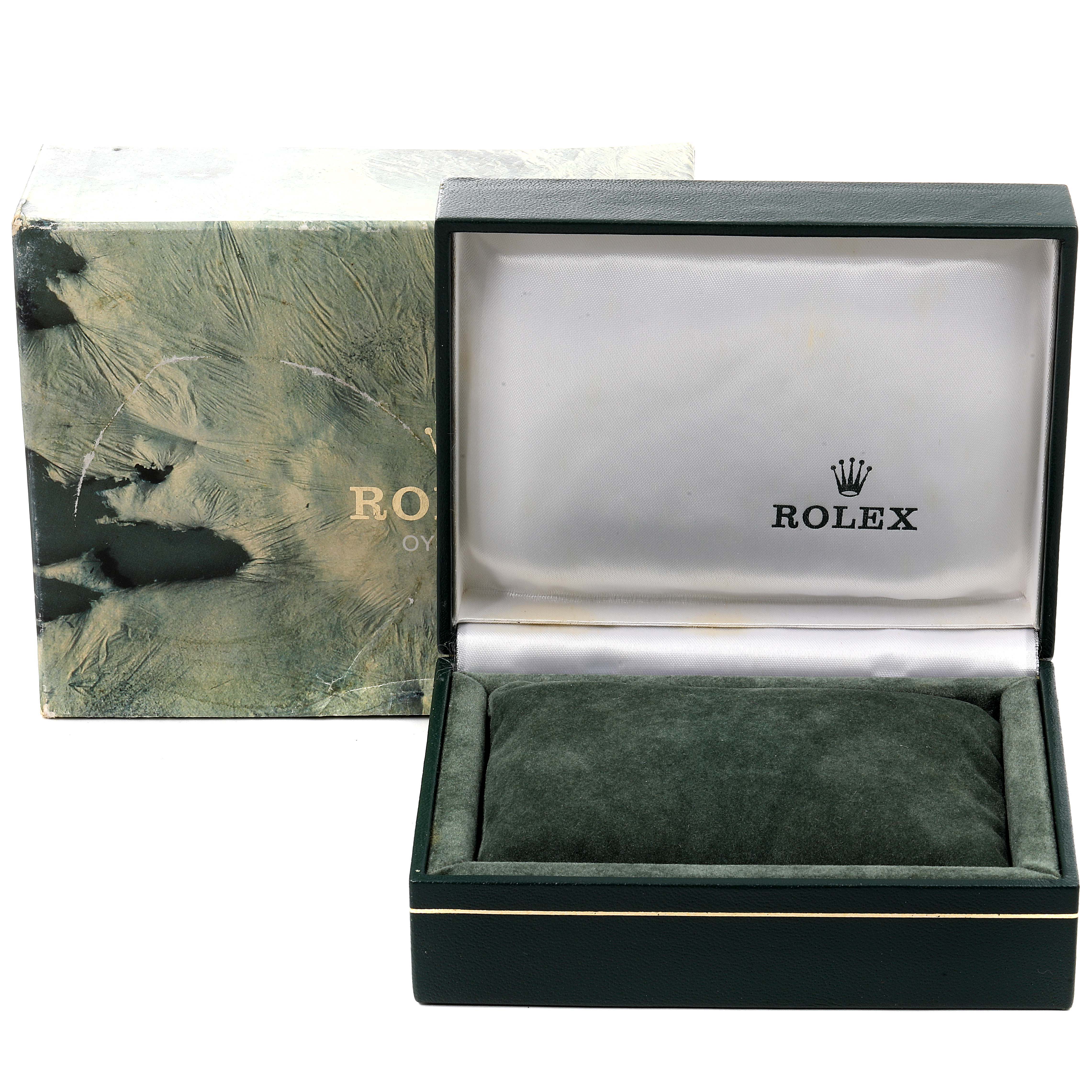The image shows an empty green Rolex watch box and its outer packaging for the Vintage Collection model.